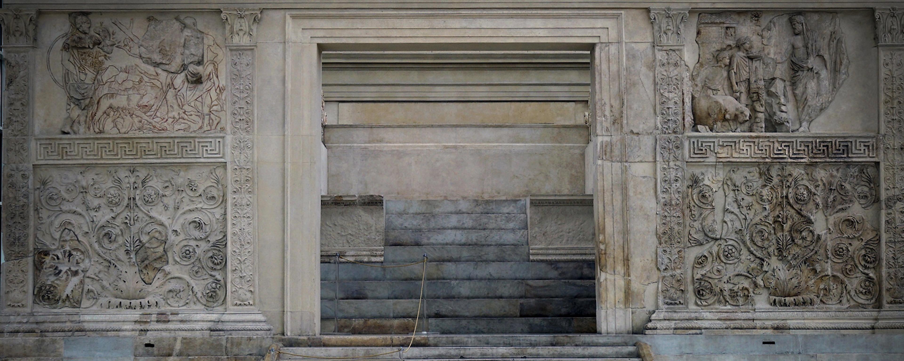 Photo of an ancient marble altar with intricate carvings and steps, showcasing classical architectural details and patterns.