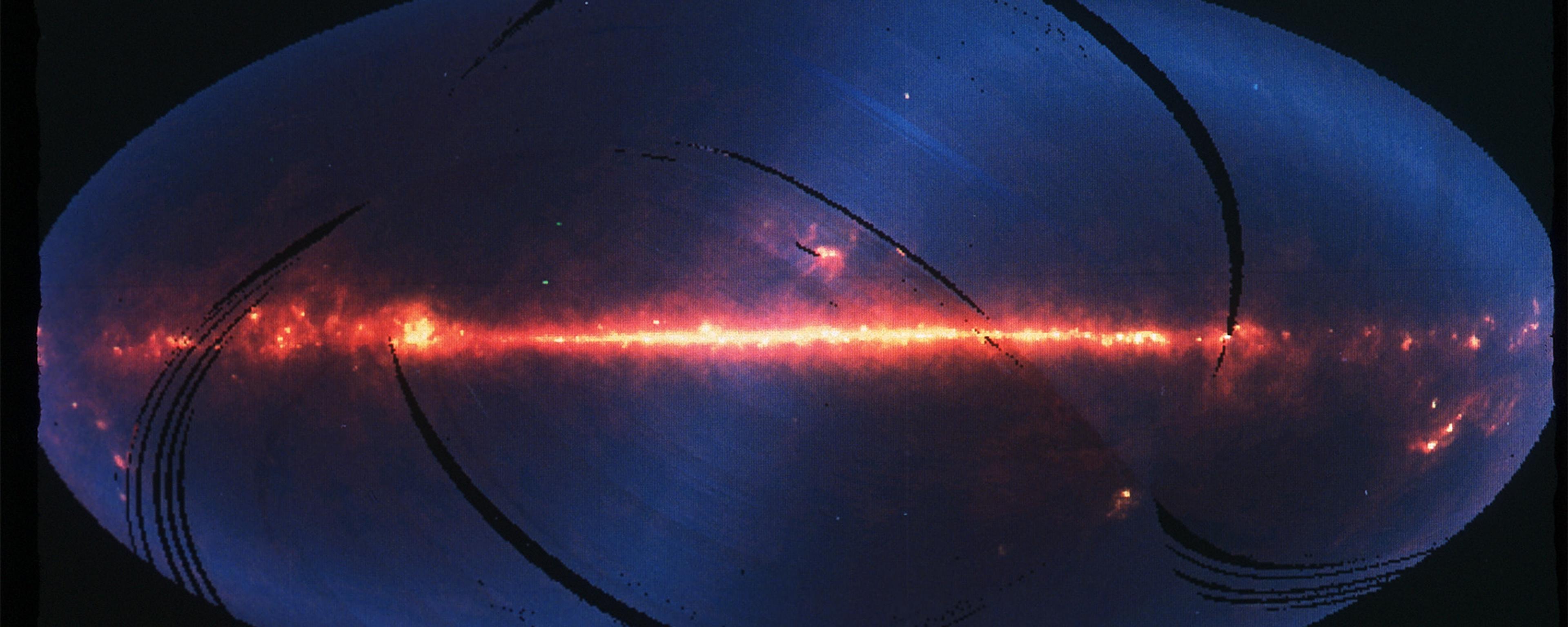 Infrared image of the Milky Way shows a glowing red band of stars across a blue background, indicating cosmic dust and gas.