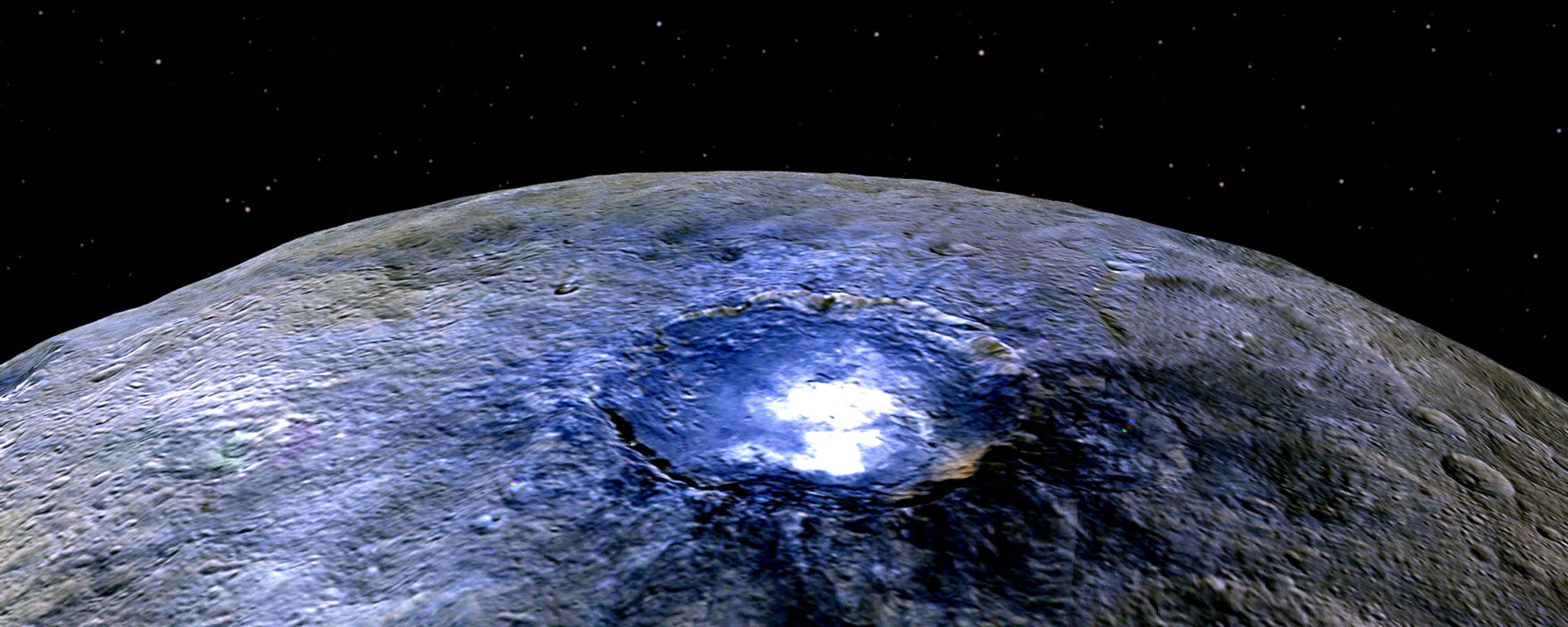 Enhanced image of Ceres’ surface showing a bright crater and stars in space.