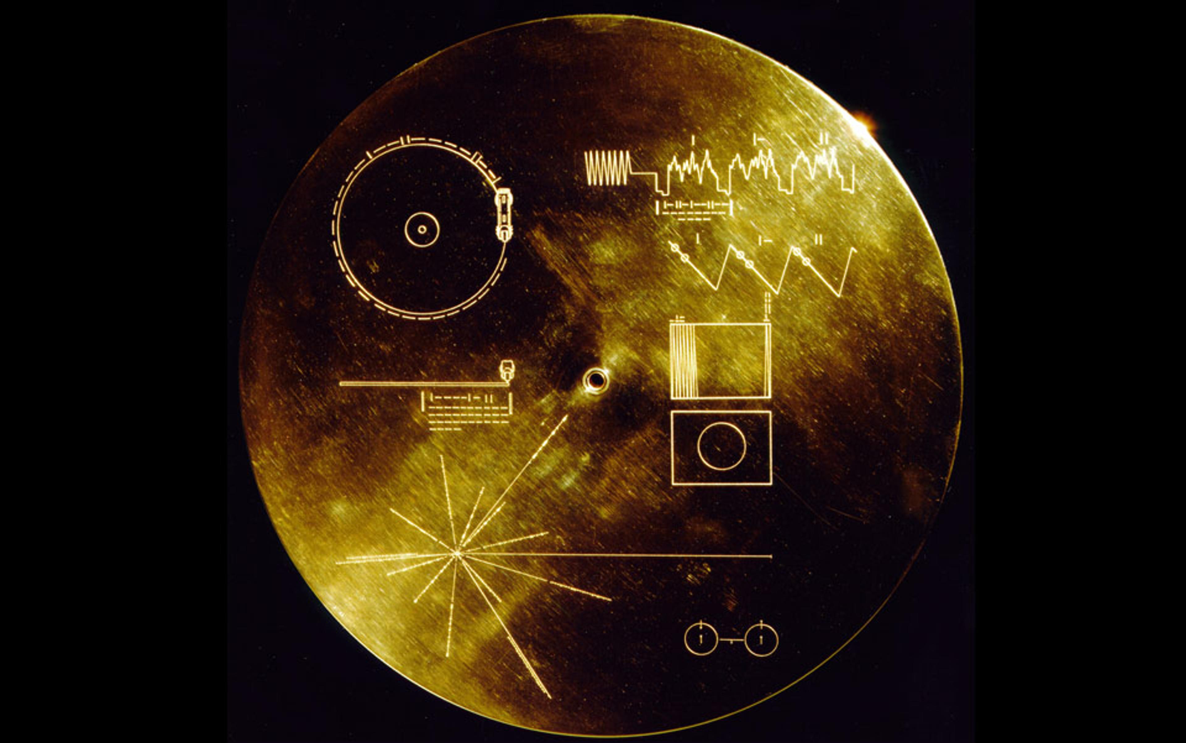 The Golden Record, a gold-plated copper disk with engraved diagrams that was sent into space aboard the Voyager spacecraft.