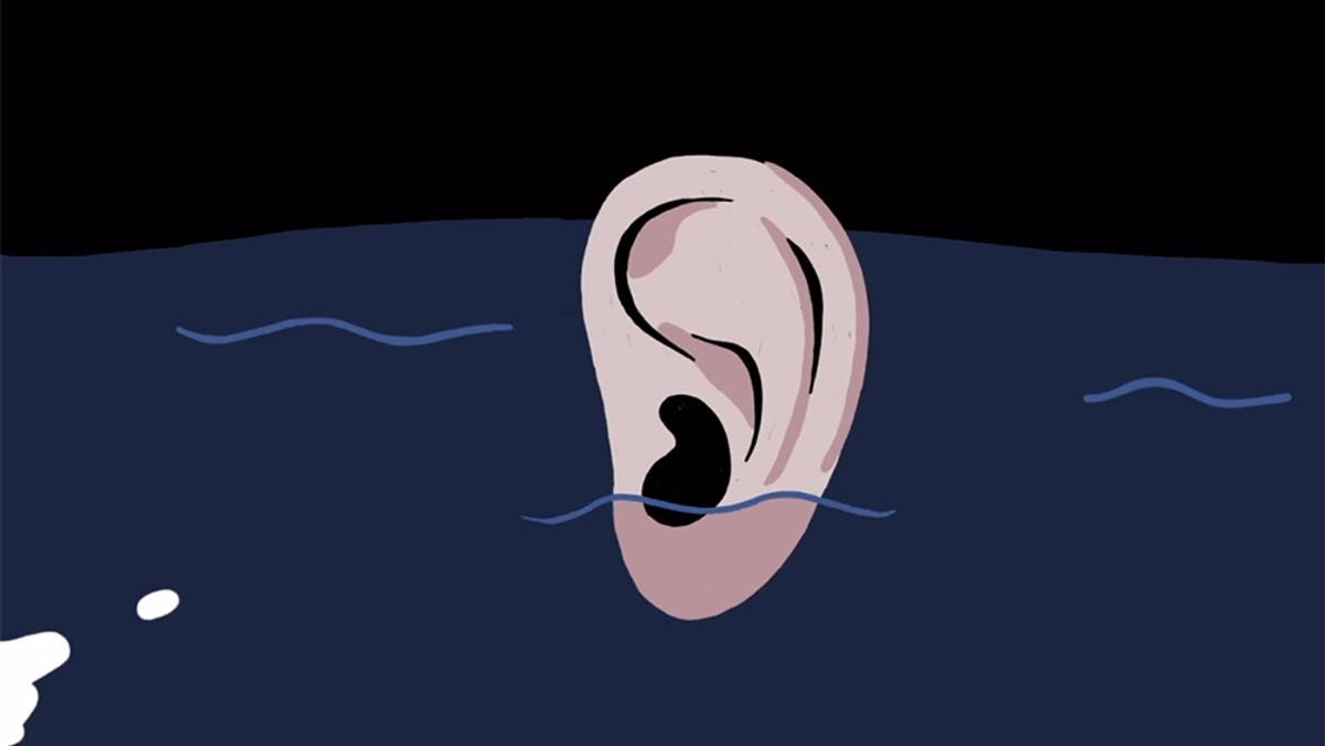 Illustration of a large ear floating in dark blue water against a black background, with small light blue waves around it.