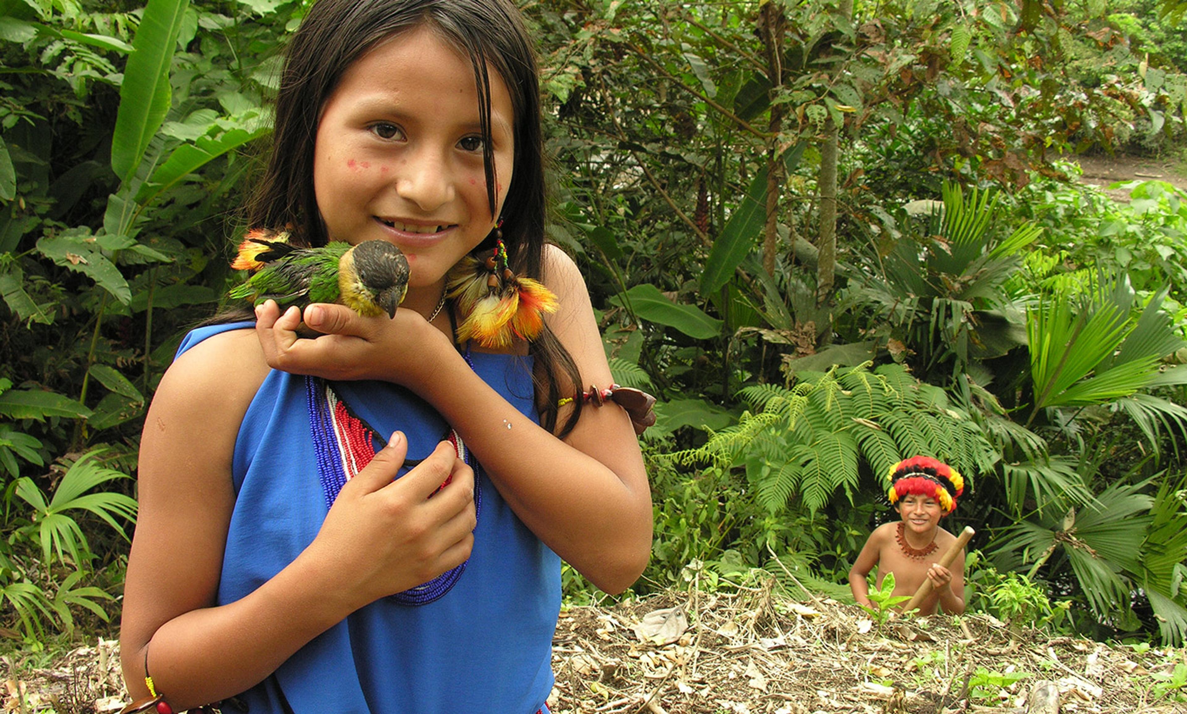 <p>Two Shuar children play in the rainforest in Amazonian Ecuador. <em>Photo by David Ducoin/Gamma-Rapho/Getty</em></p>