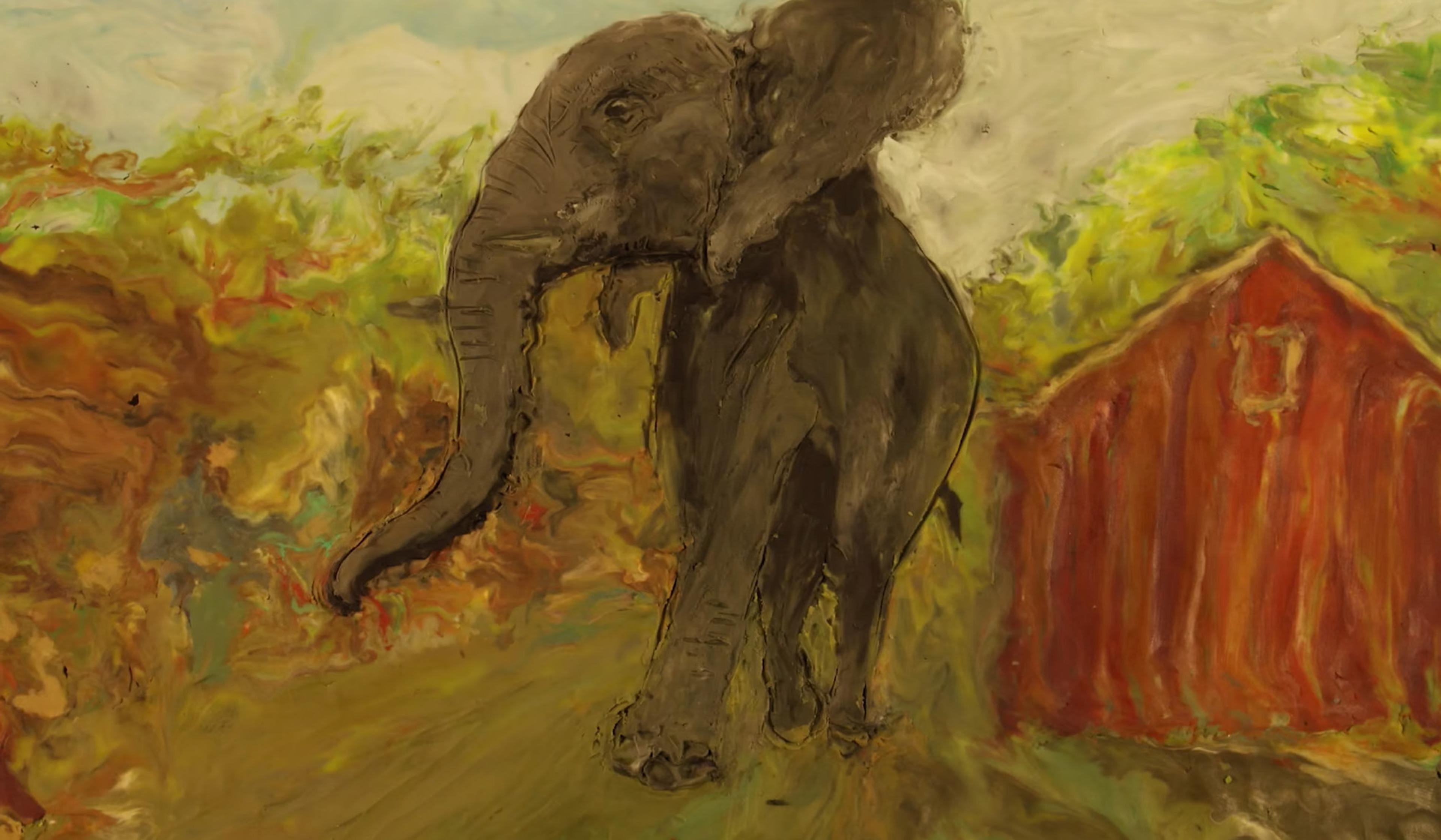 Painting of an elephant in a colourful, abstract landscape with a red building on the right and greenery in the background.
