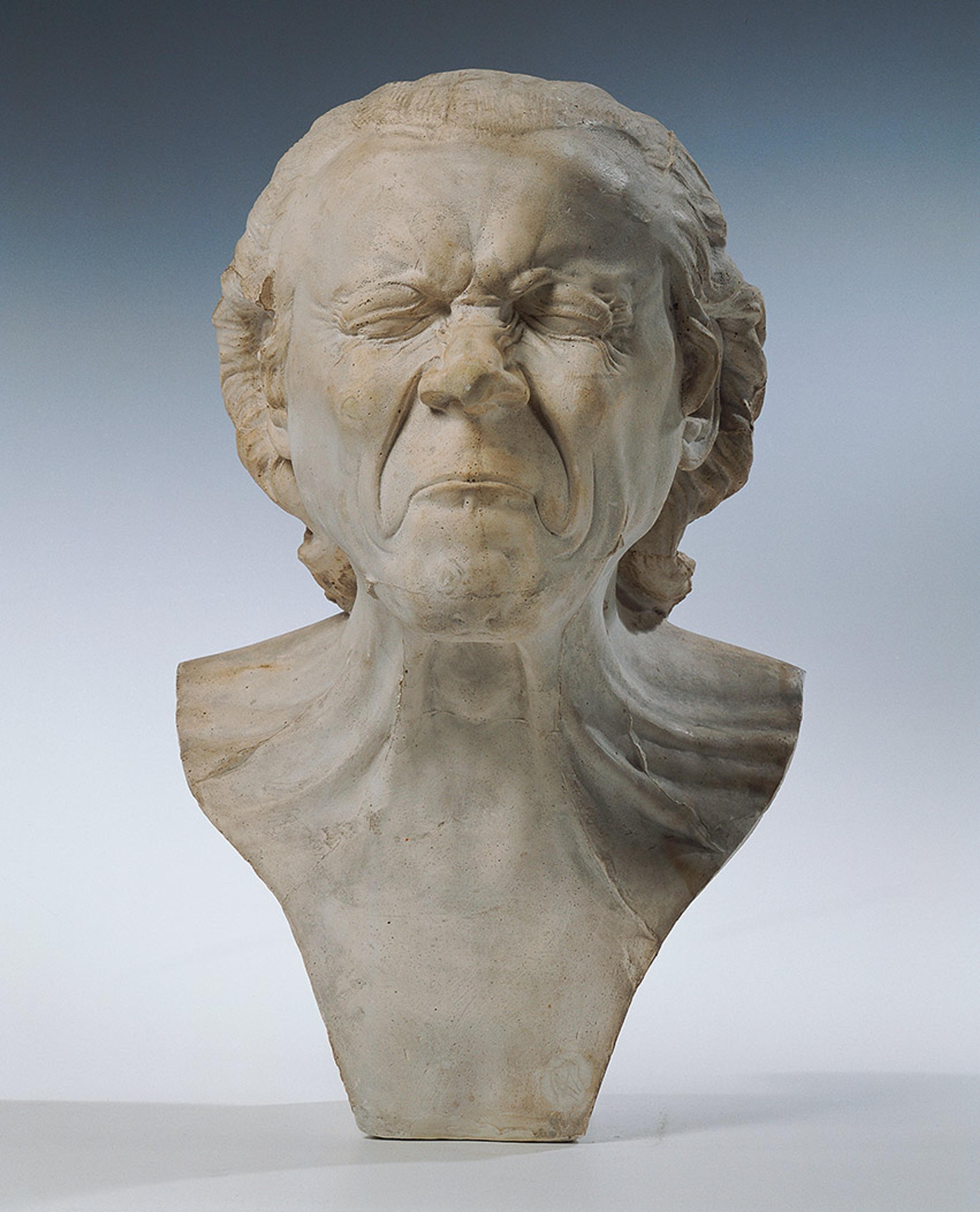 Bust depicting a person with a scrunched-up face, downturned mouth and closed eyes expressing intense emotion.