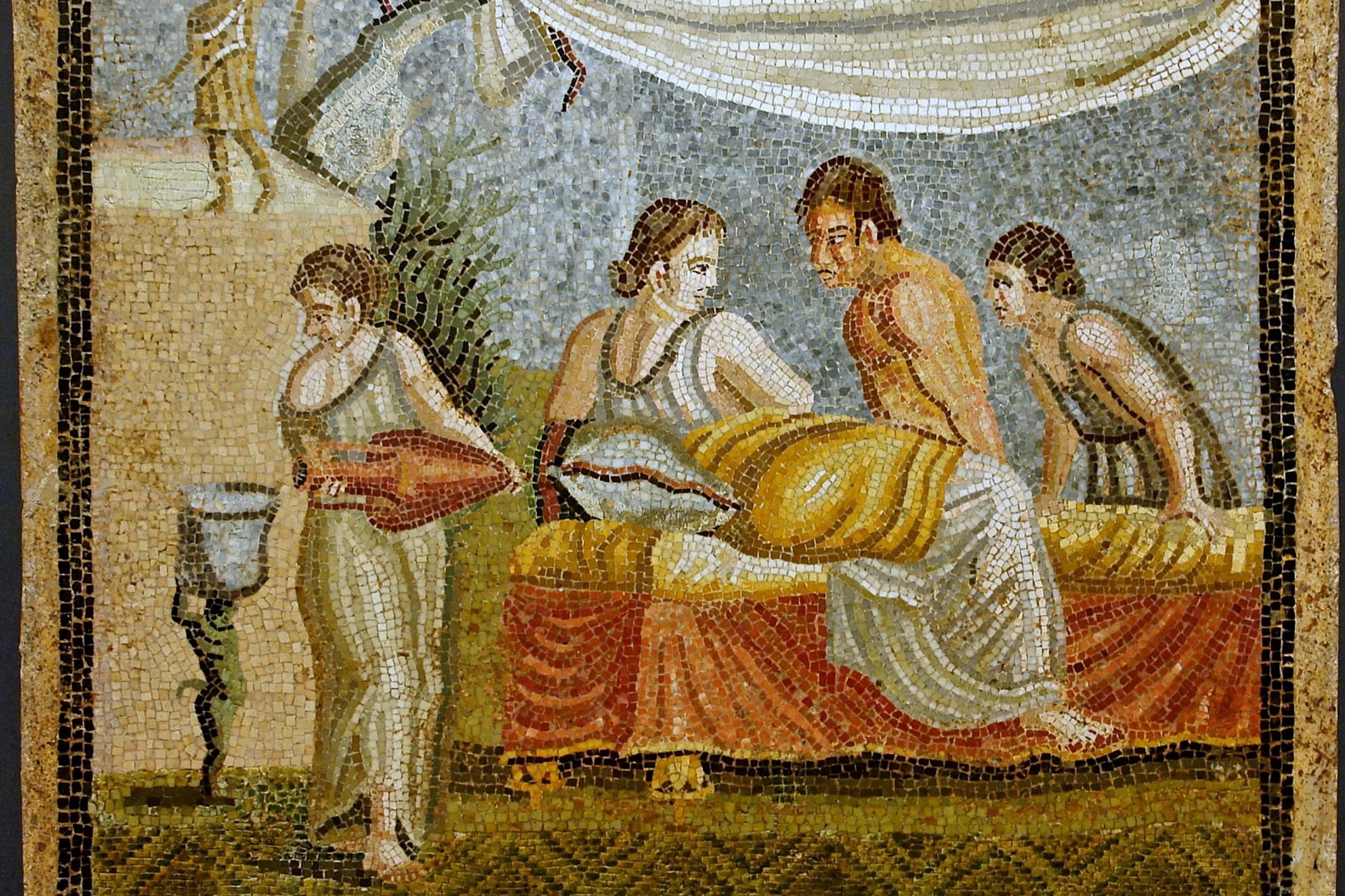Ancient Roman mosaic of four people gathered around a reclined figure on a bed with draped fabric overhead.
