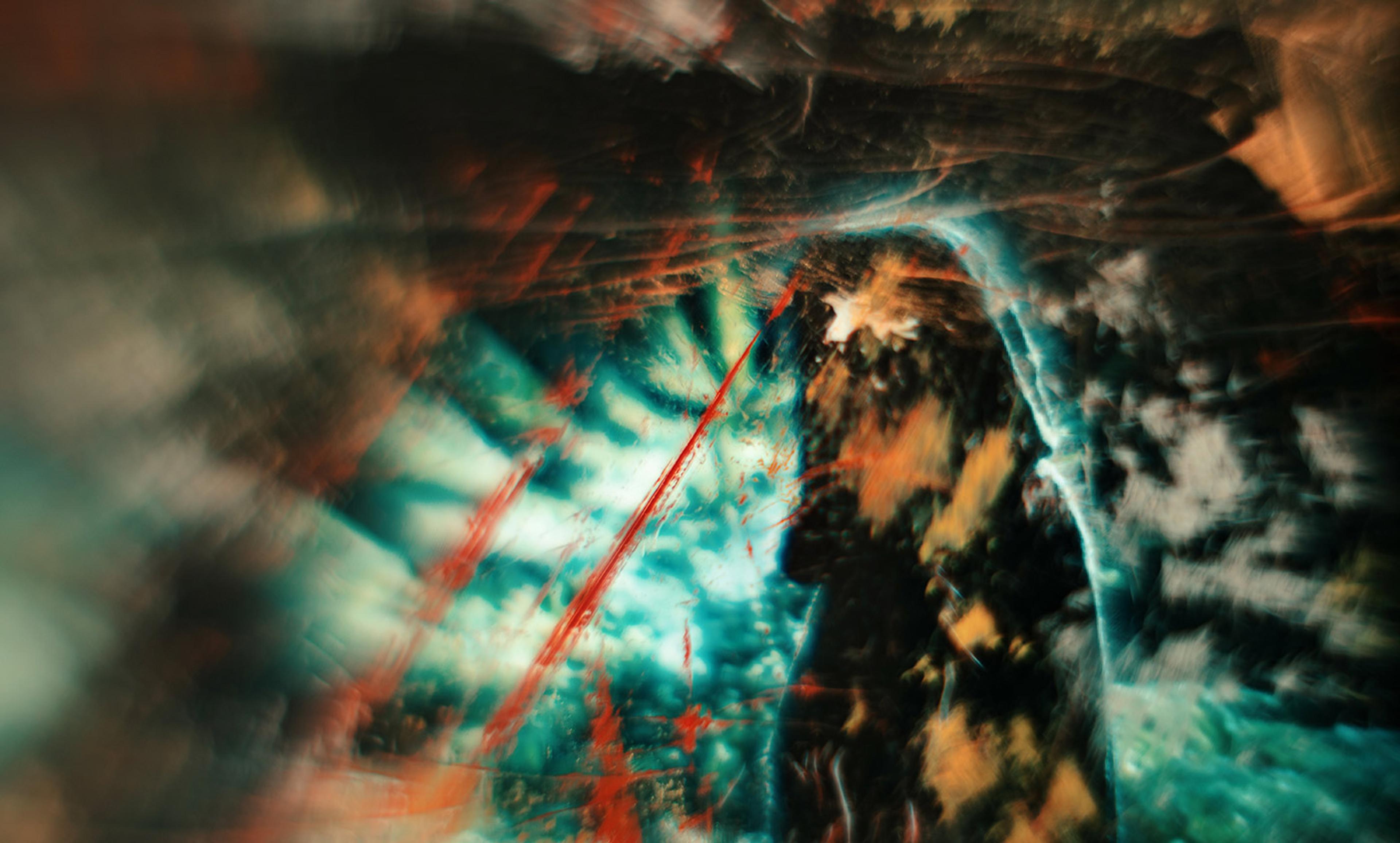 Abstract painting with blurred, swirling patterns of teal, orange, and red lines. The composition has dynamic, chaotic energy.