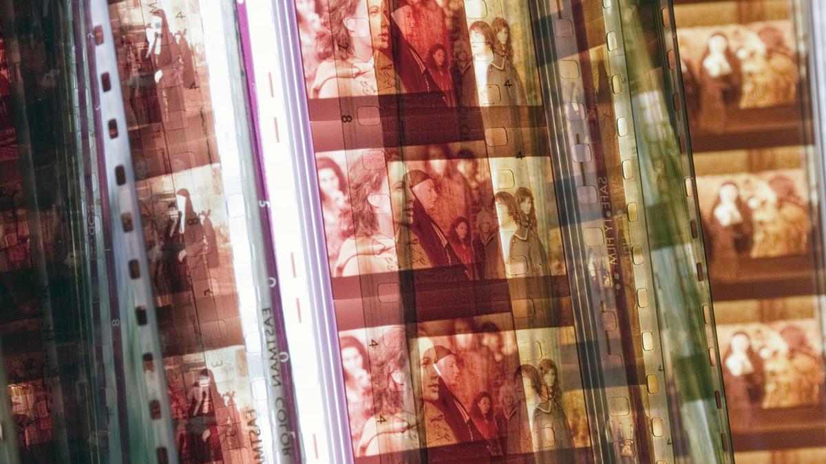 Overlapping filmstrips with frames showing various people in warm tones, creating a layered visual effect.