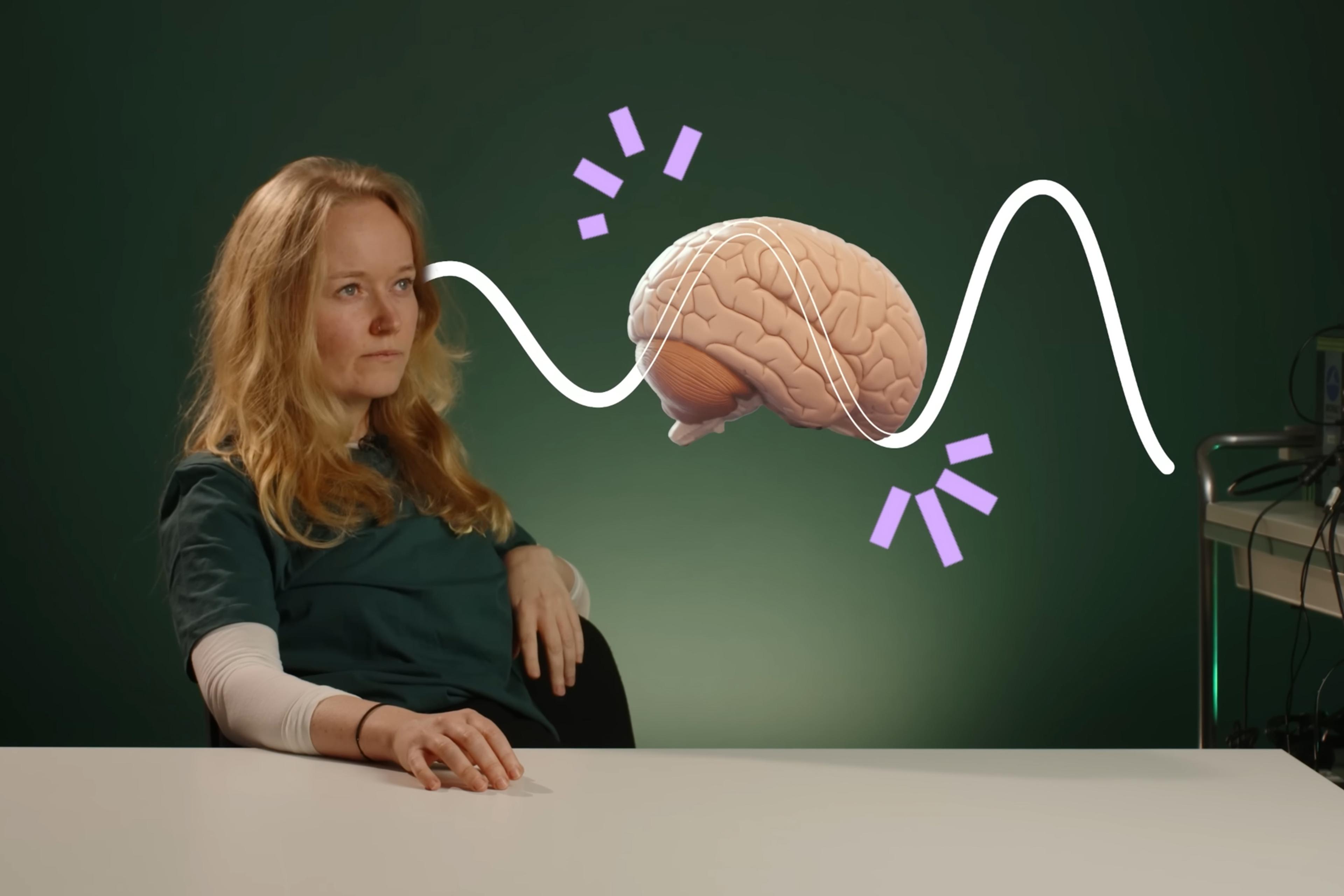 A person sitting beside a graphic brain illustration with wave patterns on a green background.