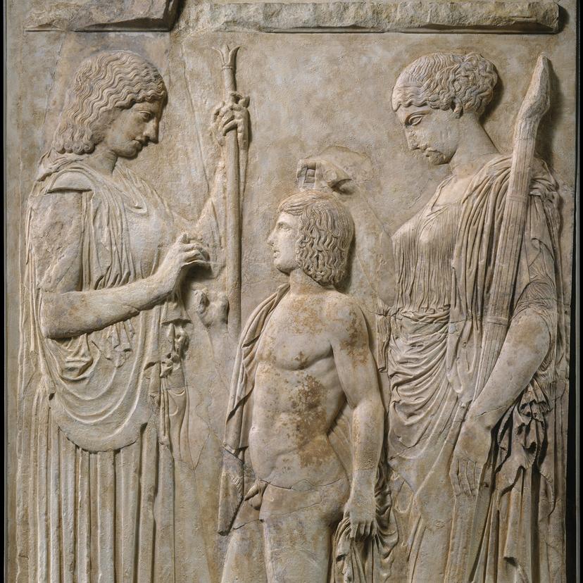 Bas-relief sculpture depicting the three most important figures of the Eleusianian Mysteries: the goddess of agriculture and abundance Demeter, her daughter Persephone, queen of the Underworld, and the Eleusinian hero Triptolemus, in what appears to be a rite. Triptolemus stands in the centre, the two goddesses stand either side.