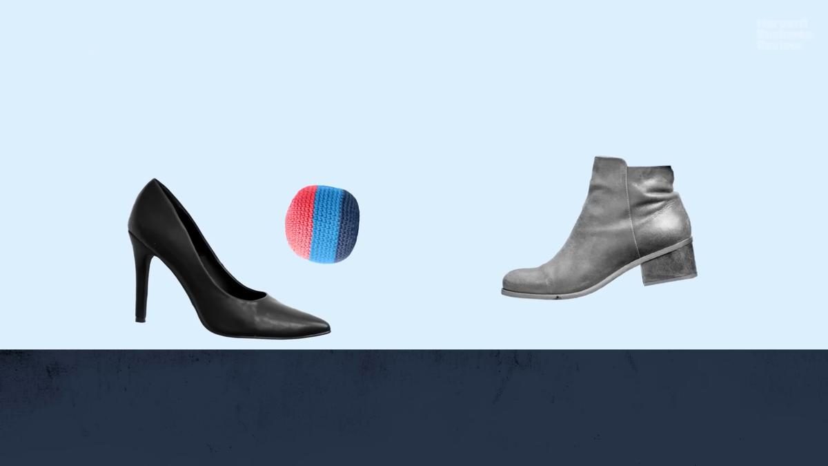 Image showing a black high heel, a red and blue ball and a grey ankle boot on a light blue background.