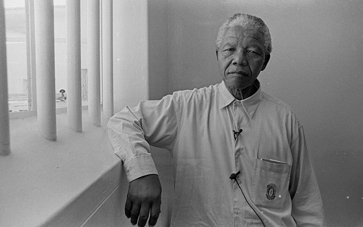 Former South African president Nelson Mandela revisits his prison cell on Robben Island, in 1994. Photo by Jurgen Schadeberg/Getty Images Former South