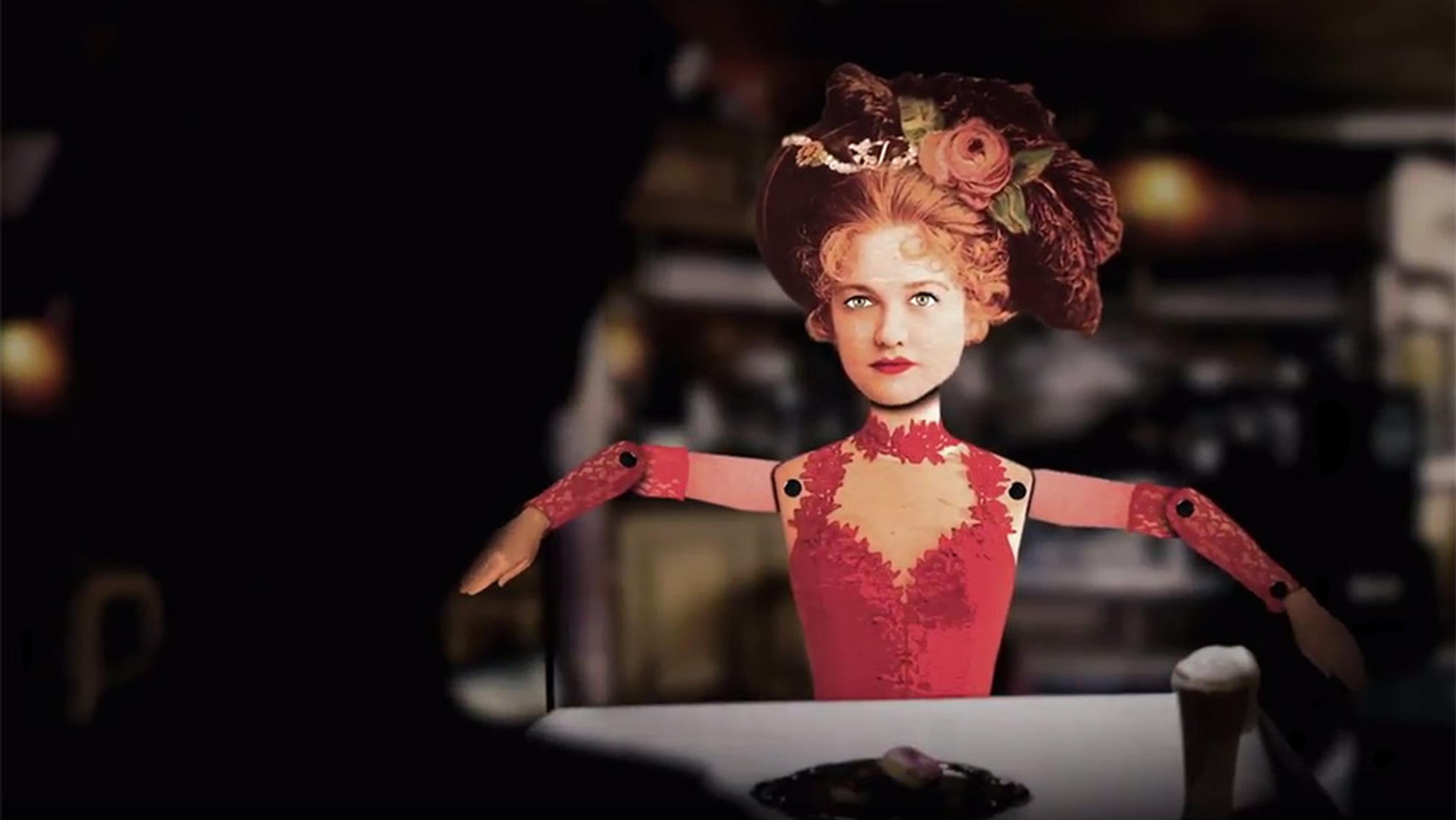 Collage art of a woman with red hair in a vintage dress and hat, positioned as a puppet, sitting in front of a blurred background.