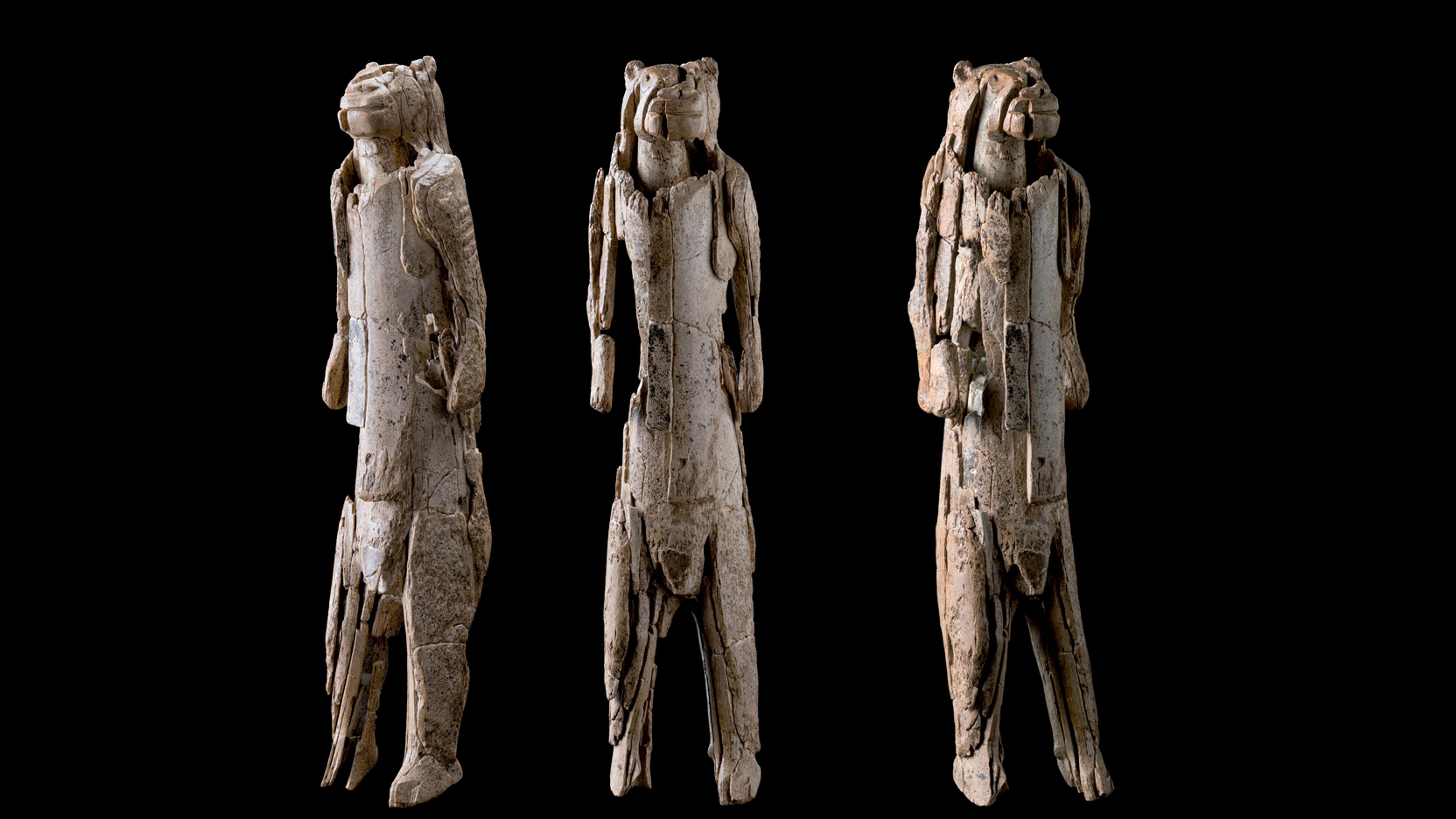 Ivory sculpture of a lion-human figure shown from three angles on a black background.