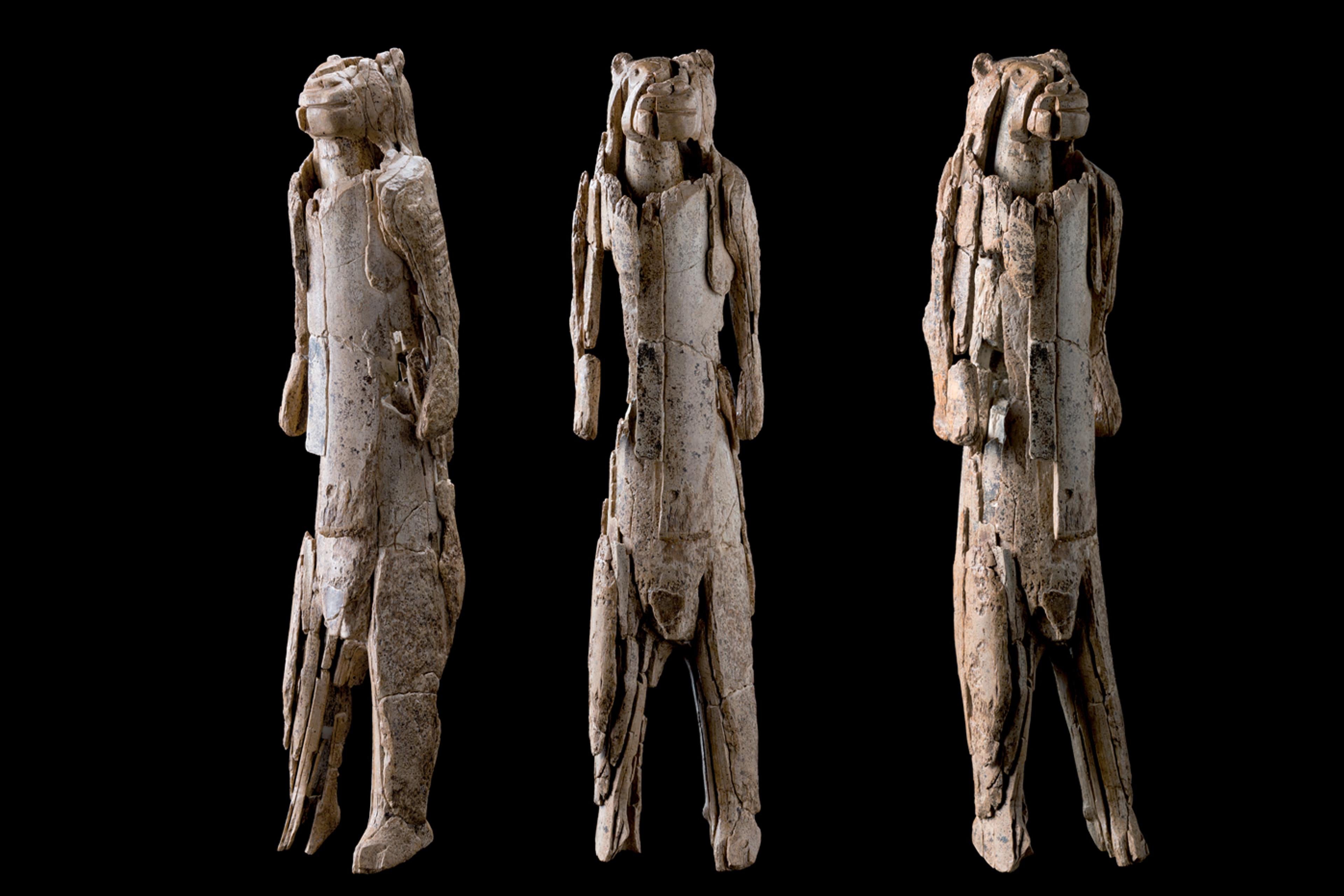 Ivory sculpture of a lion-human figure shown from three angles on a black background.
