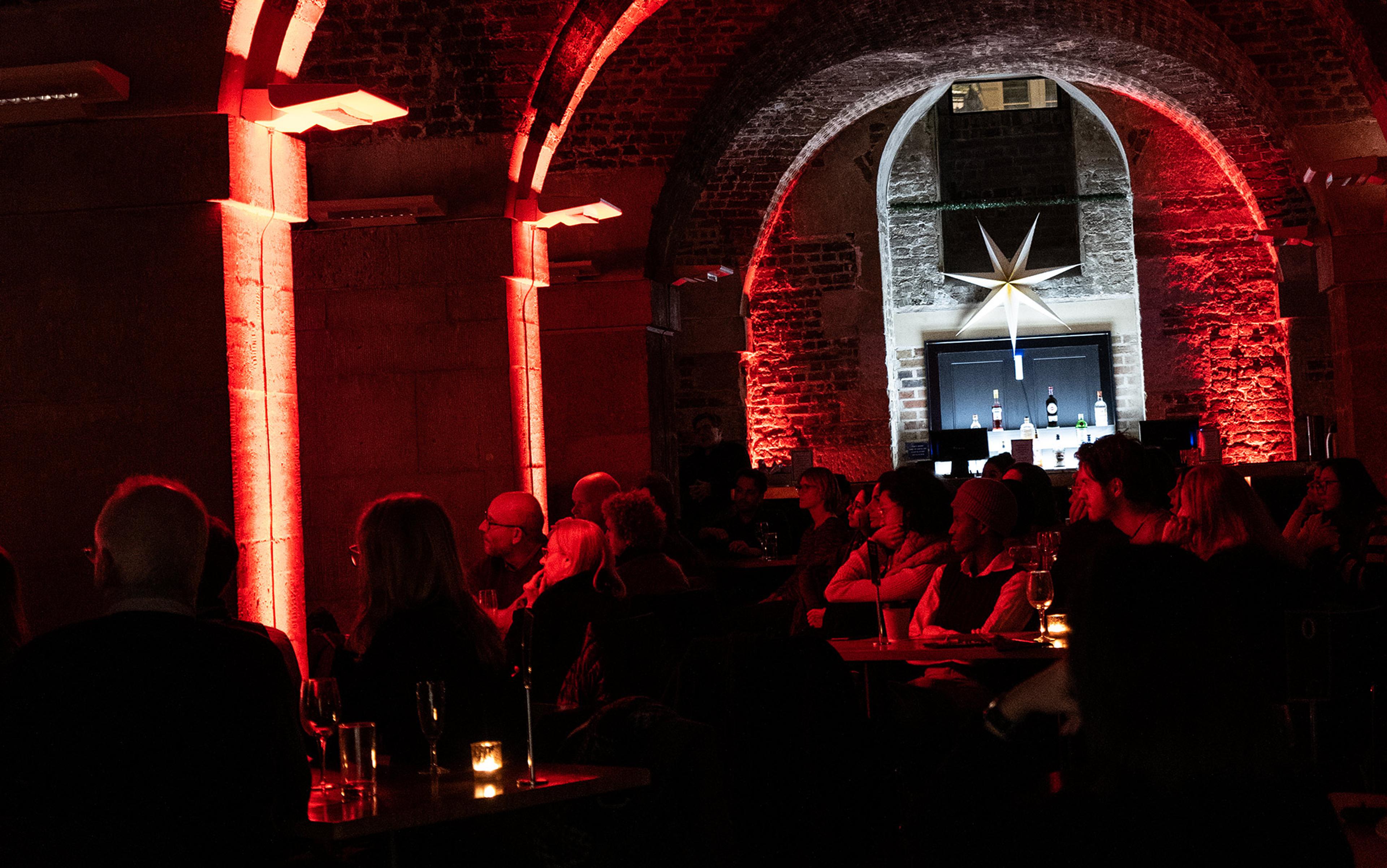 The audience looking towards the stage in The Crypt