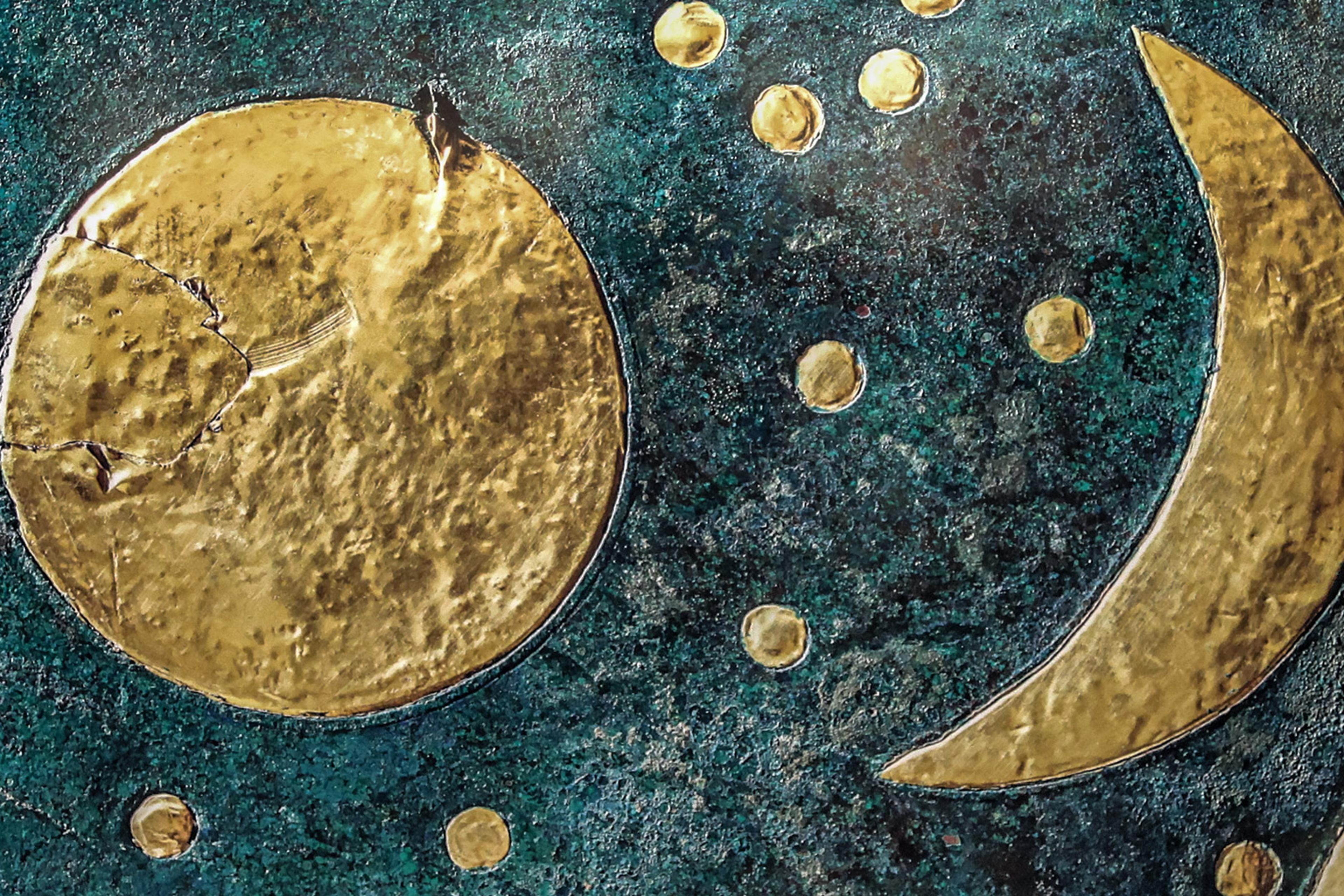 Ancient artefact with gold sun, moon, and stars on a dark blue-green background, likely depicting an early astronomical observation.