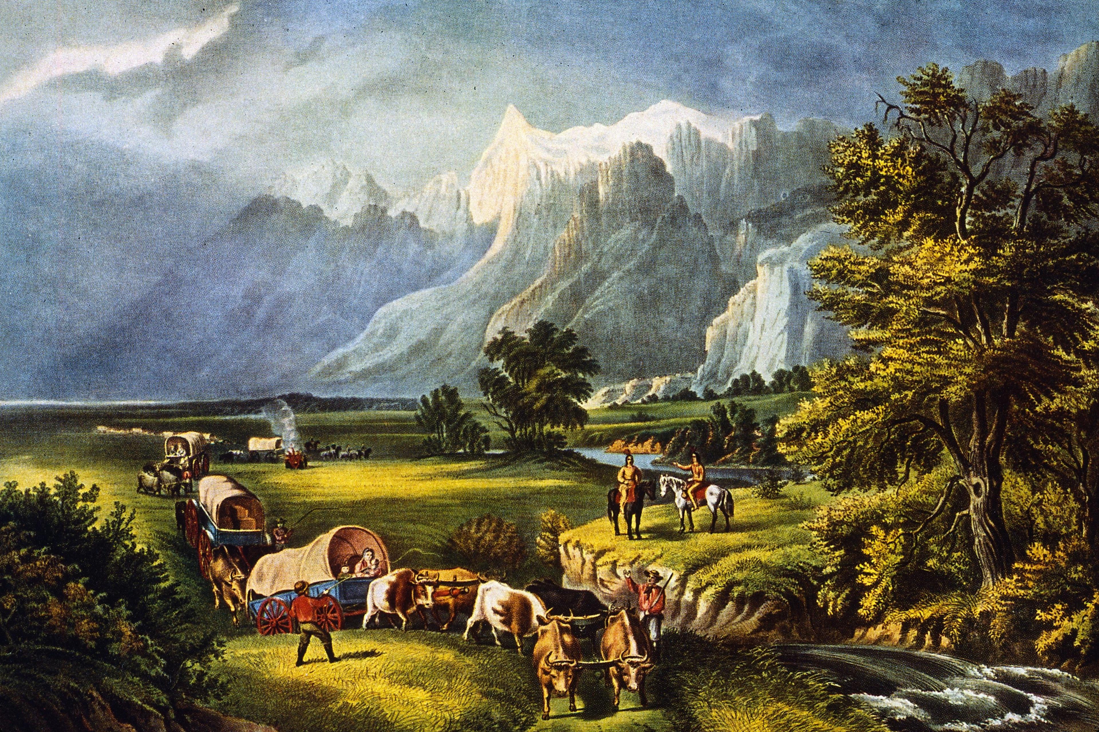 Painting of settlers in covered wagons crossing a grassy landscape with mountains in the background and people on horses nearby.