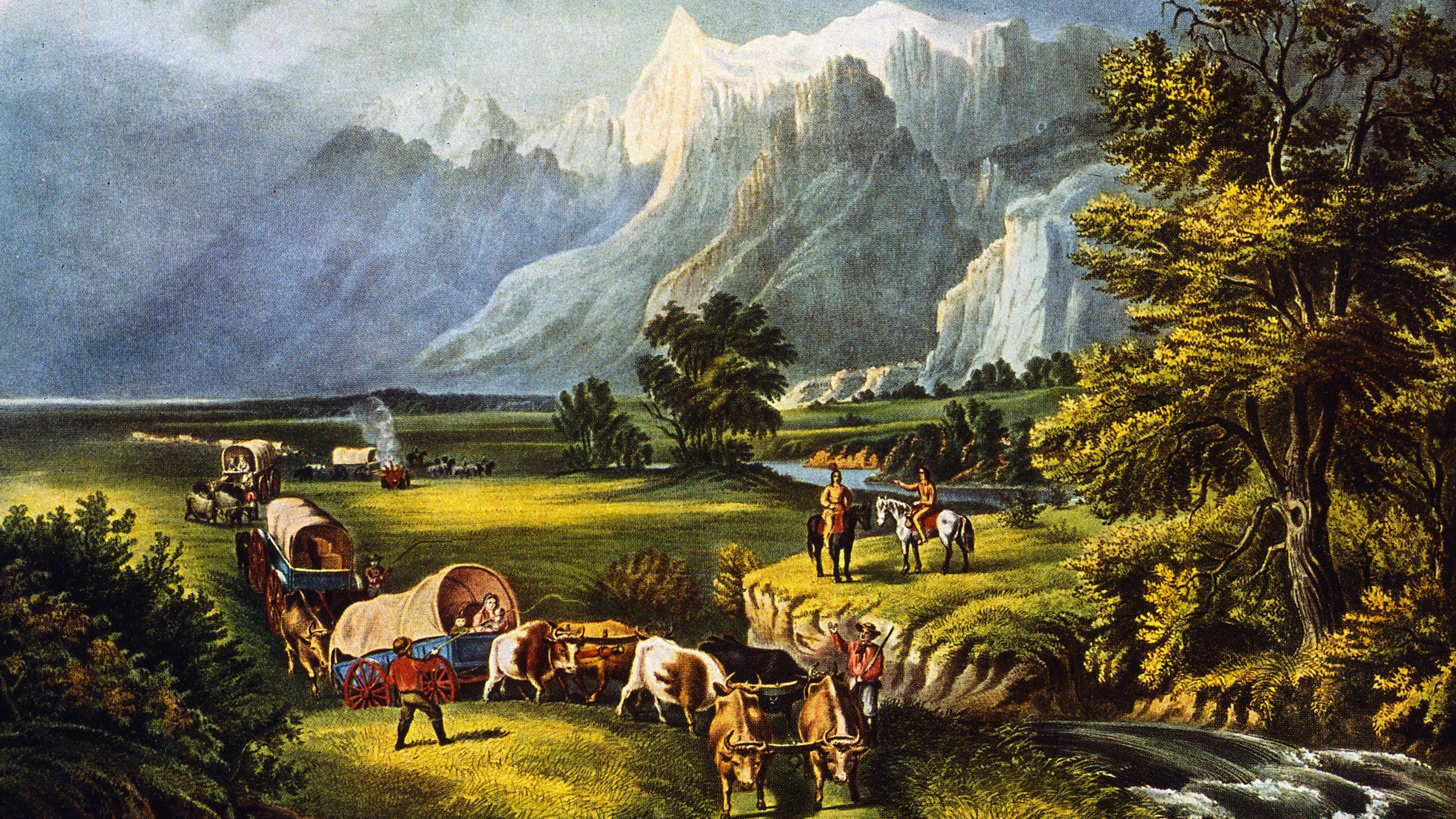 Painting of settlers in covered wagons crossing a grassy landscape with mountains in the background and people on horses nearby.