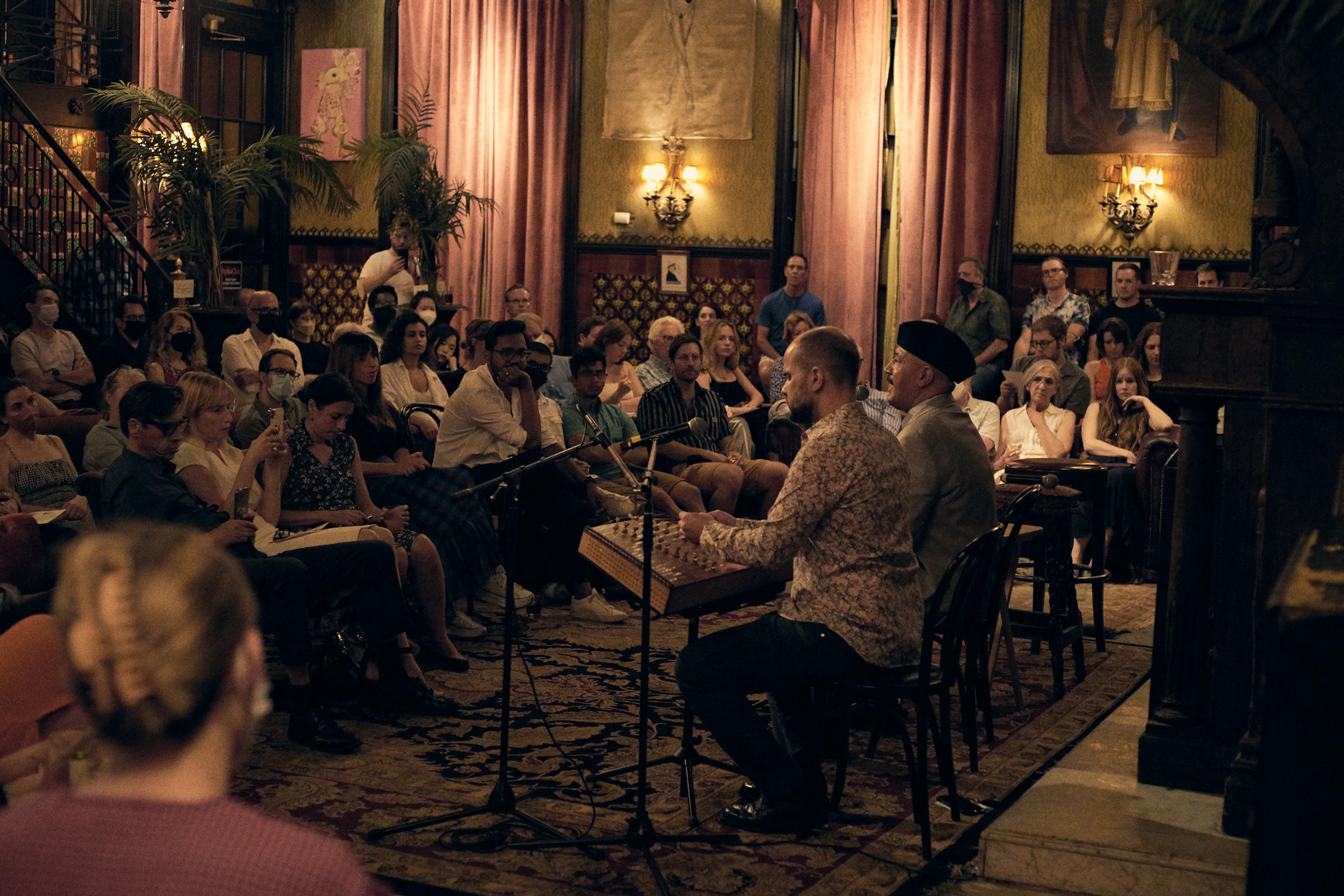 Hamid Al-Saadi performing on stage in New York