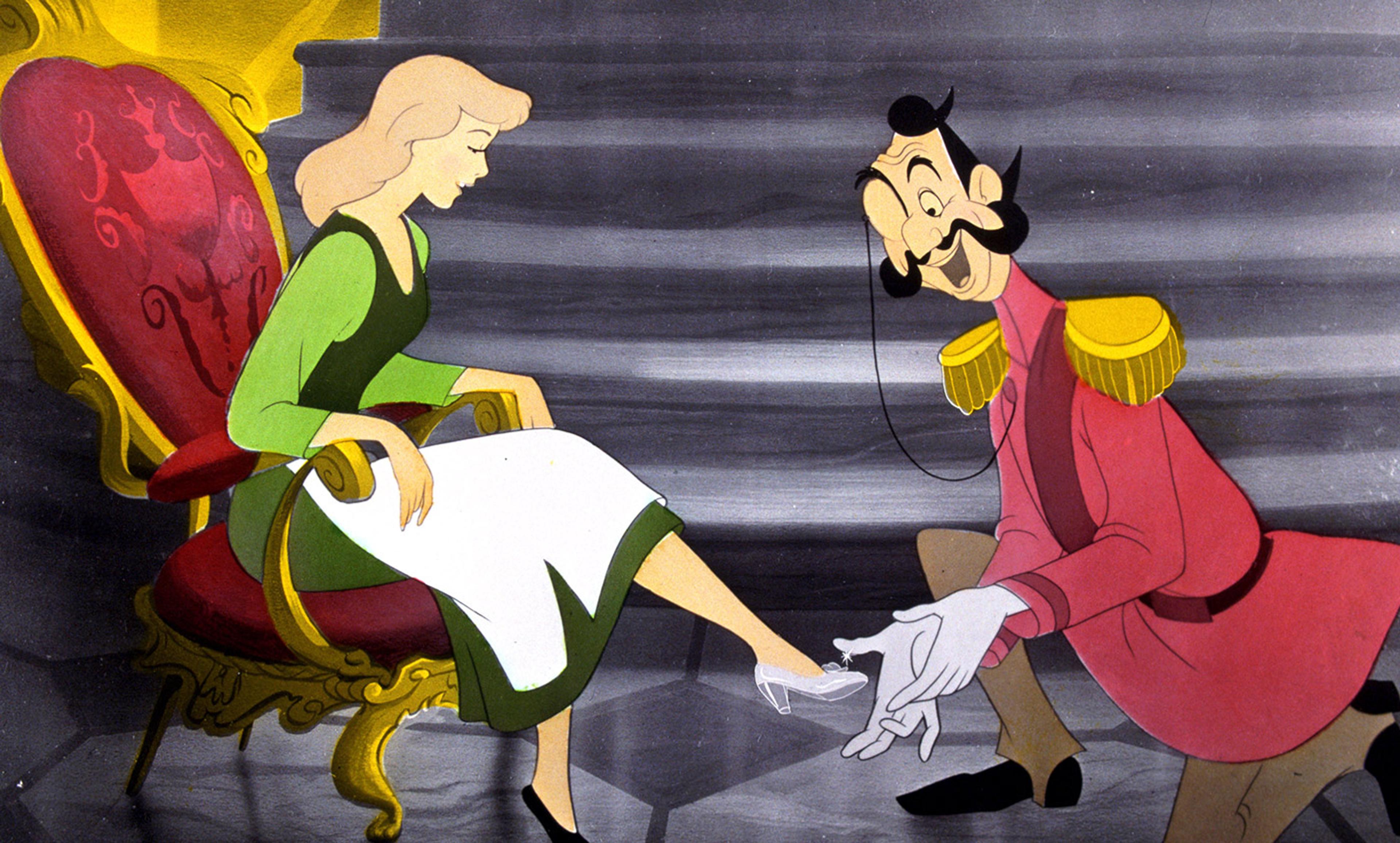 Still from an animated film of a kneeling man placing a glass slipper on the foot of a young woman seated on a decorative chair.