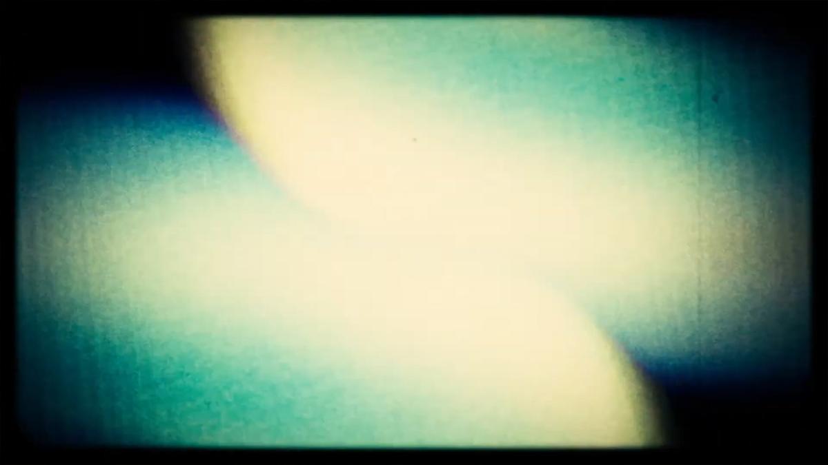 Abstract painting with blurred blue, yellow and black shapes creating a soft, dreamlike texture.