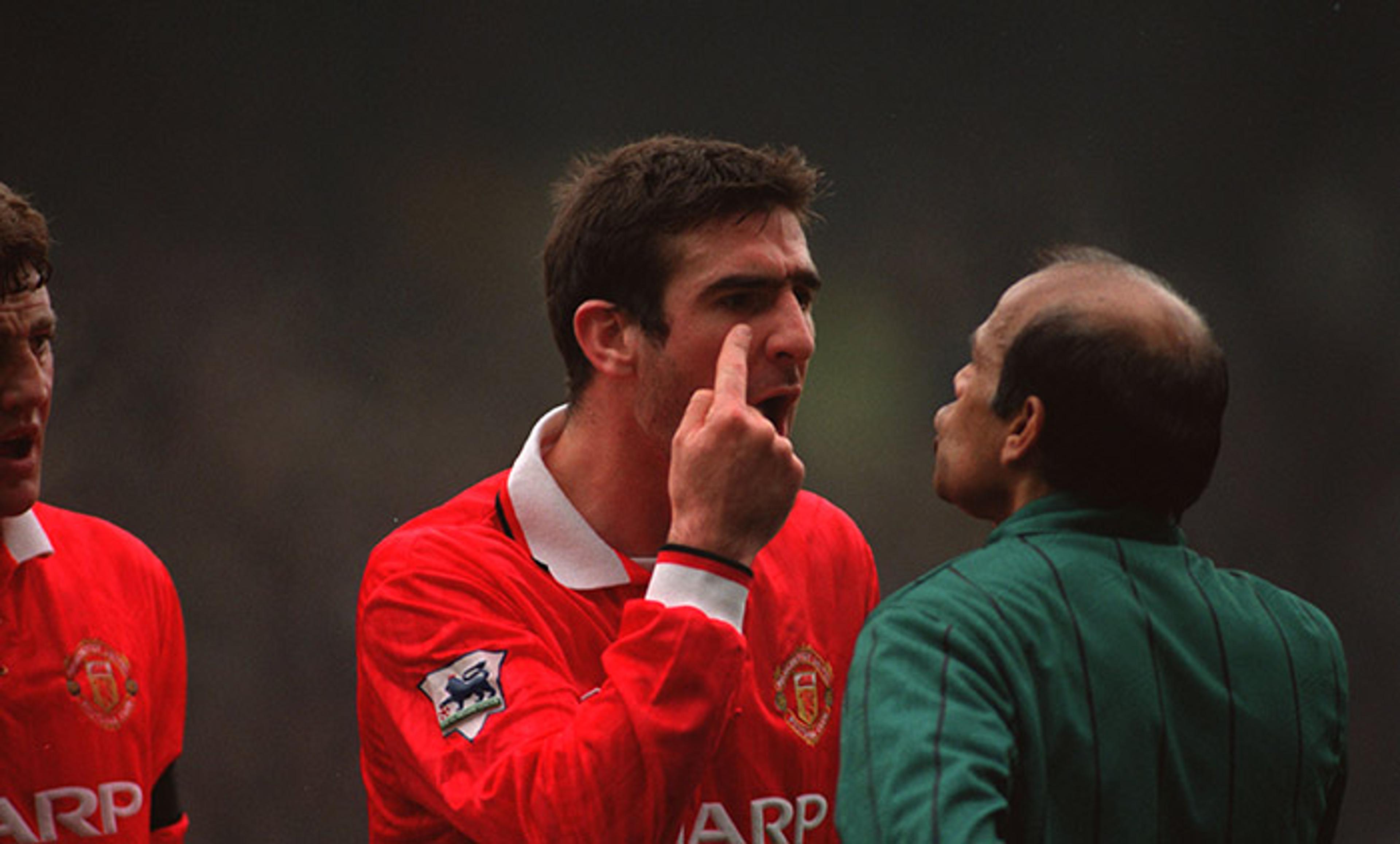 <p>Mercurial Manchester United player Eric Cantona has something in his eye. <em>Photo by Bob Thomas/Getty</em></p>