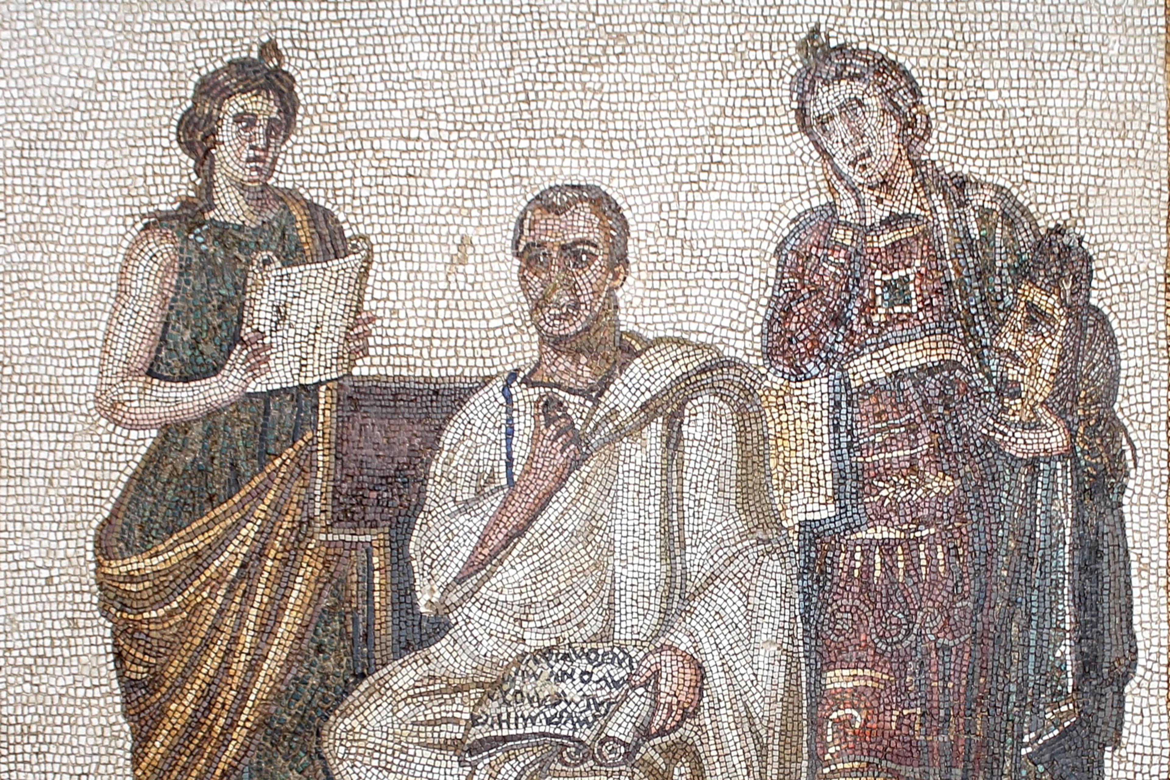 Ancient mosaic depicting a seated man and two standing figures, one holding a scroll, in a detailed Roman style scene.