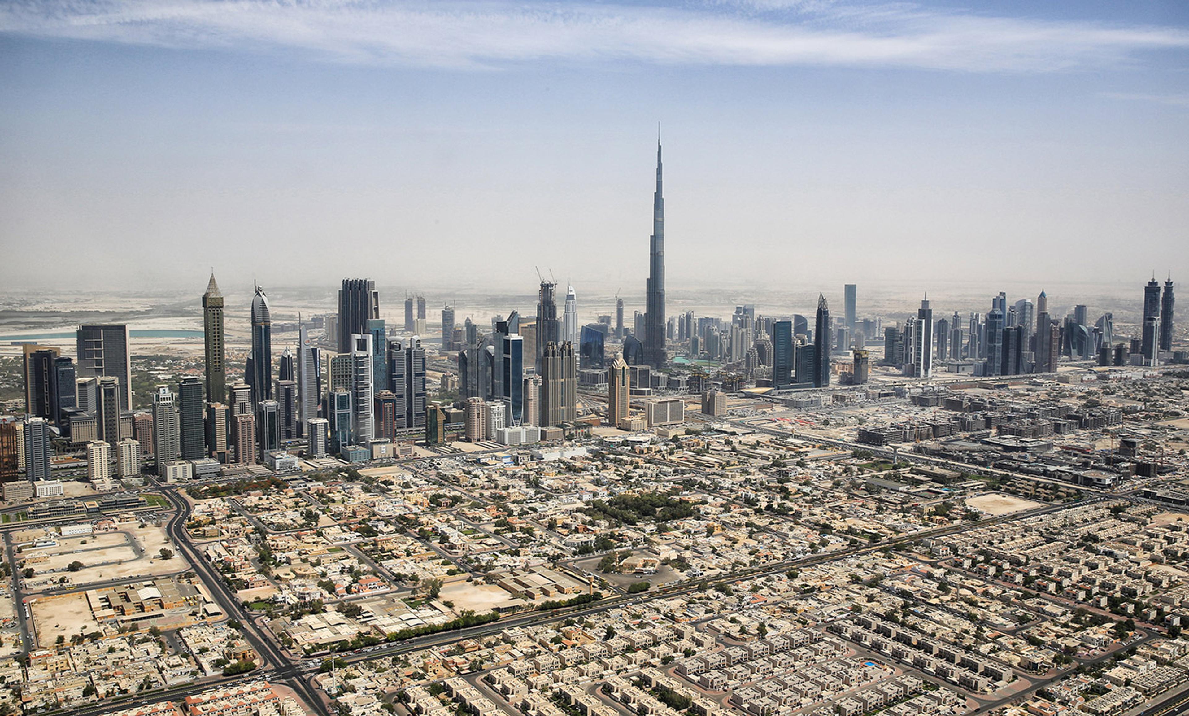 <p>The Dubai skyline featuring the Burj Khalifa (centre) in 2015. <em>Photo Tim Reckmann/Flickr </em><a href="https://creativecommons.org/licenses/by/2.0/" rel="noreferrer noopener" target="_blank">CC BY 2.0</a></p>