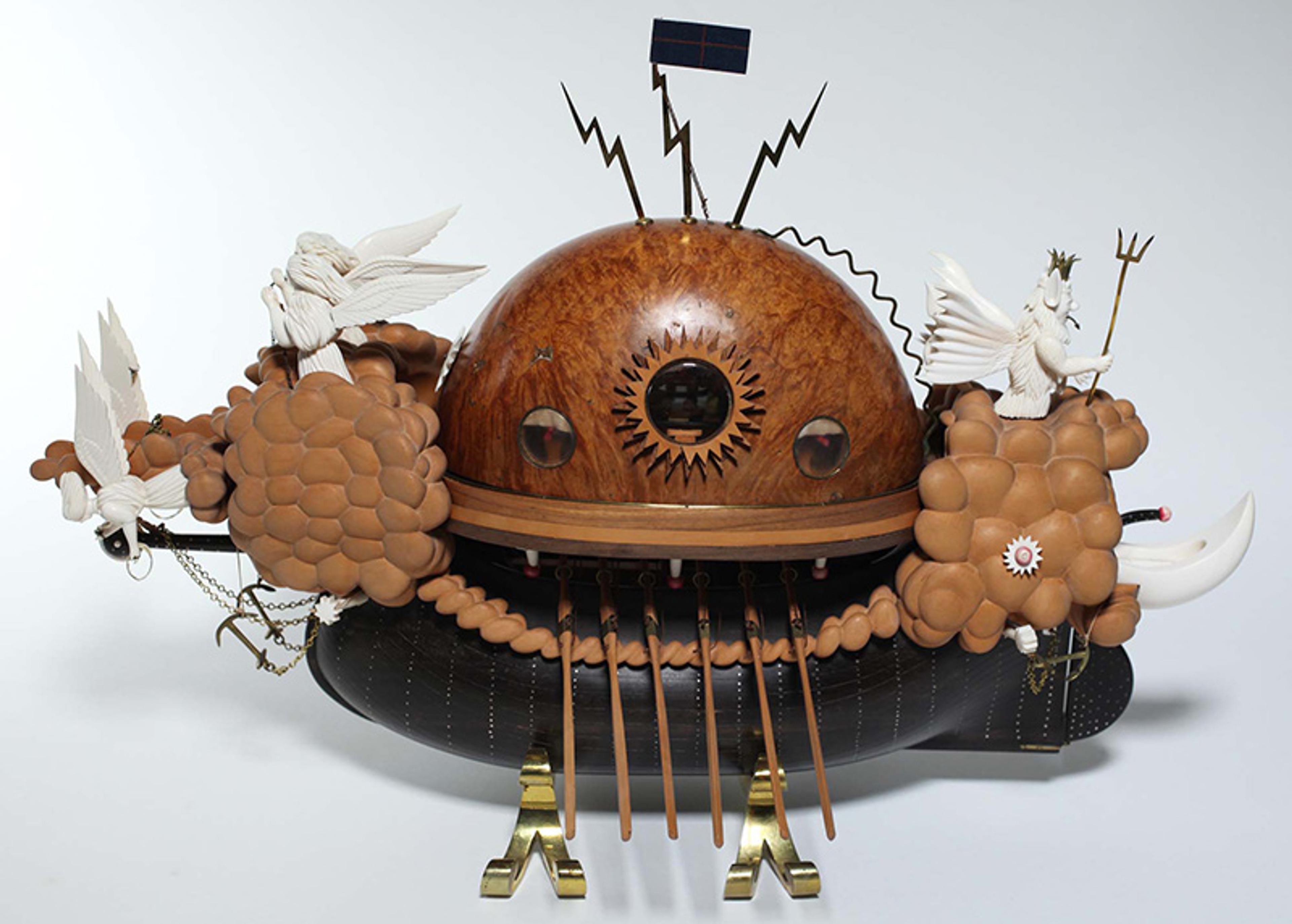 Sculpture with a wooden dome, winged figures and clouds, on top of a black blimp.