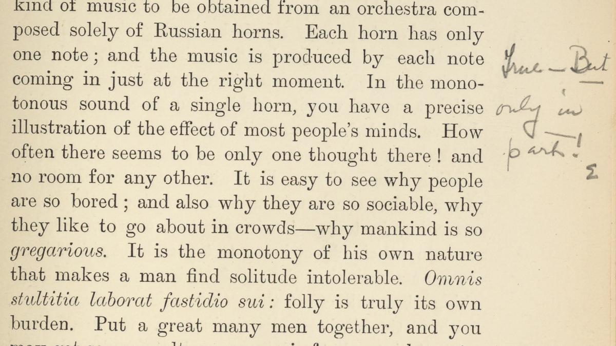 Page from a book with printed text about society and handwritten notes in the margin, including ’True but only in part‘.