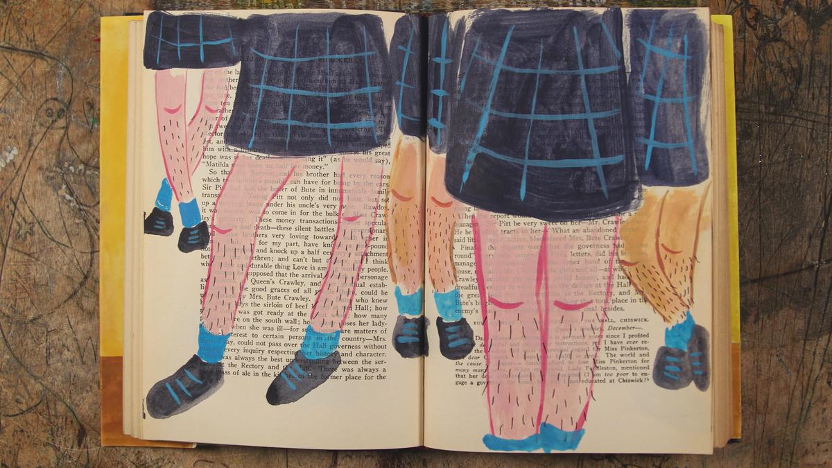 Painting of legs in blue socks and shoes overlaid on an open book page with text, laid on a wooden surface.