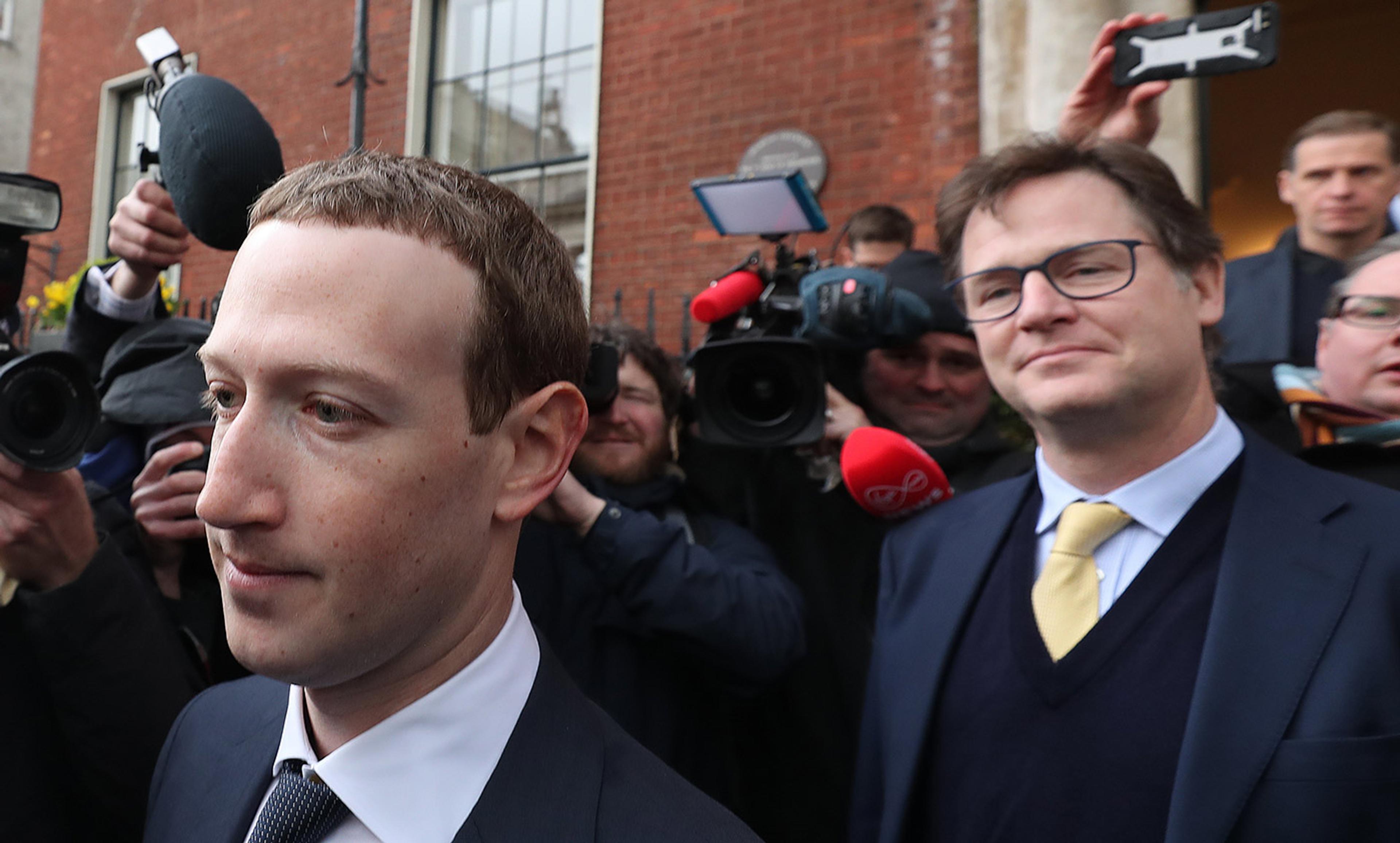<p>Nick Clegg, former British deputy prime minister and Facebook’s new vice president of global affairs and communication, stands behind Facebook CEO Mark Zuckerberg. <em>Photo by Niall Carson/PA/Getty</em></p>