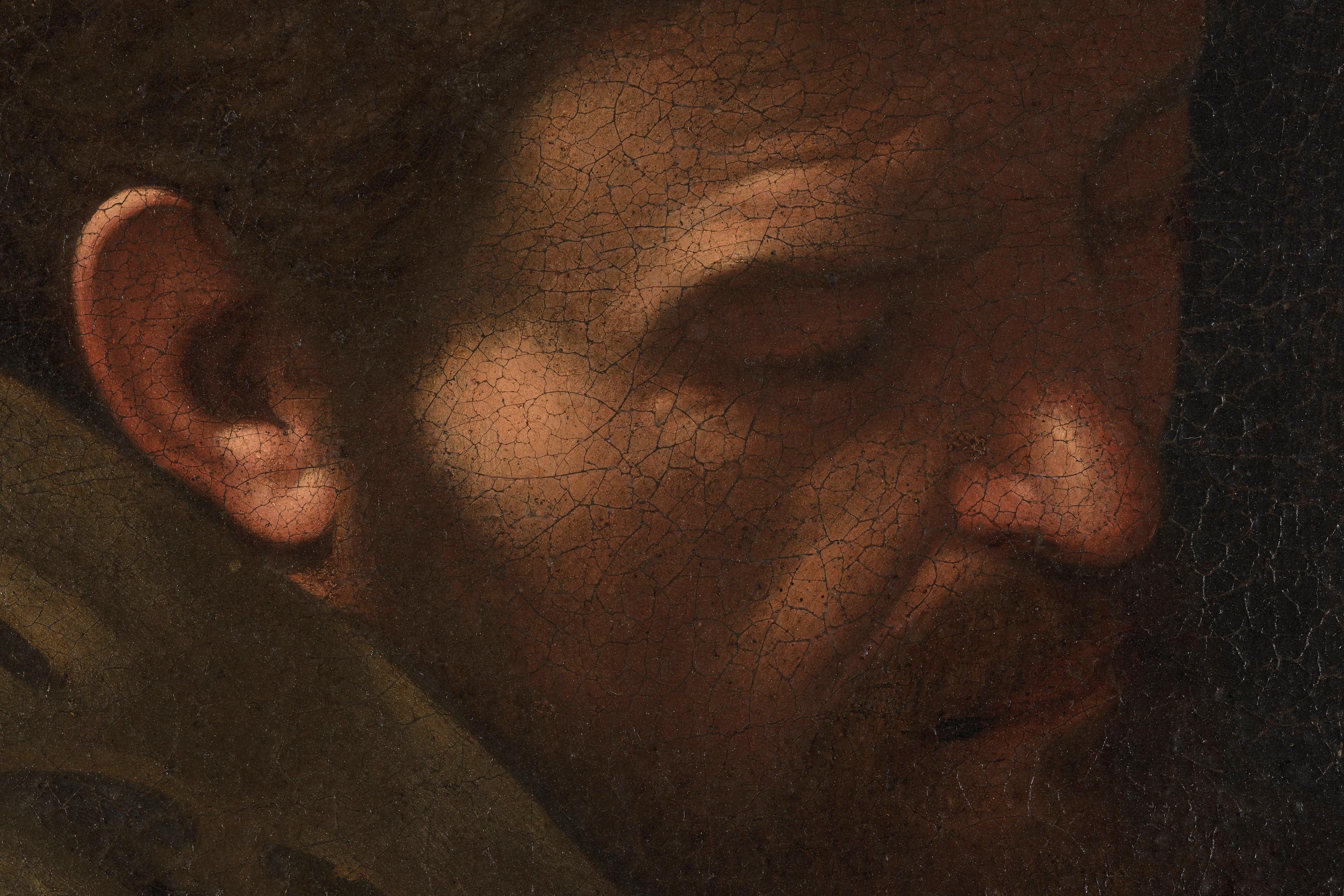 Close-up of an old painting showing a man’s face in profile with visible crackling in the paint surface.