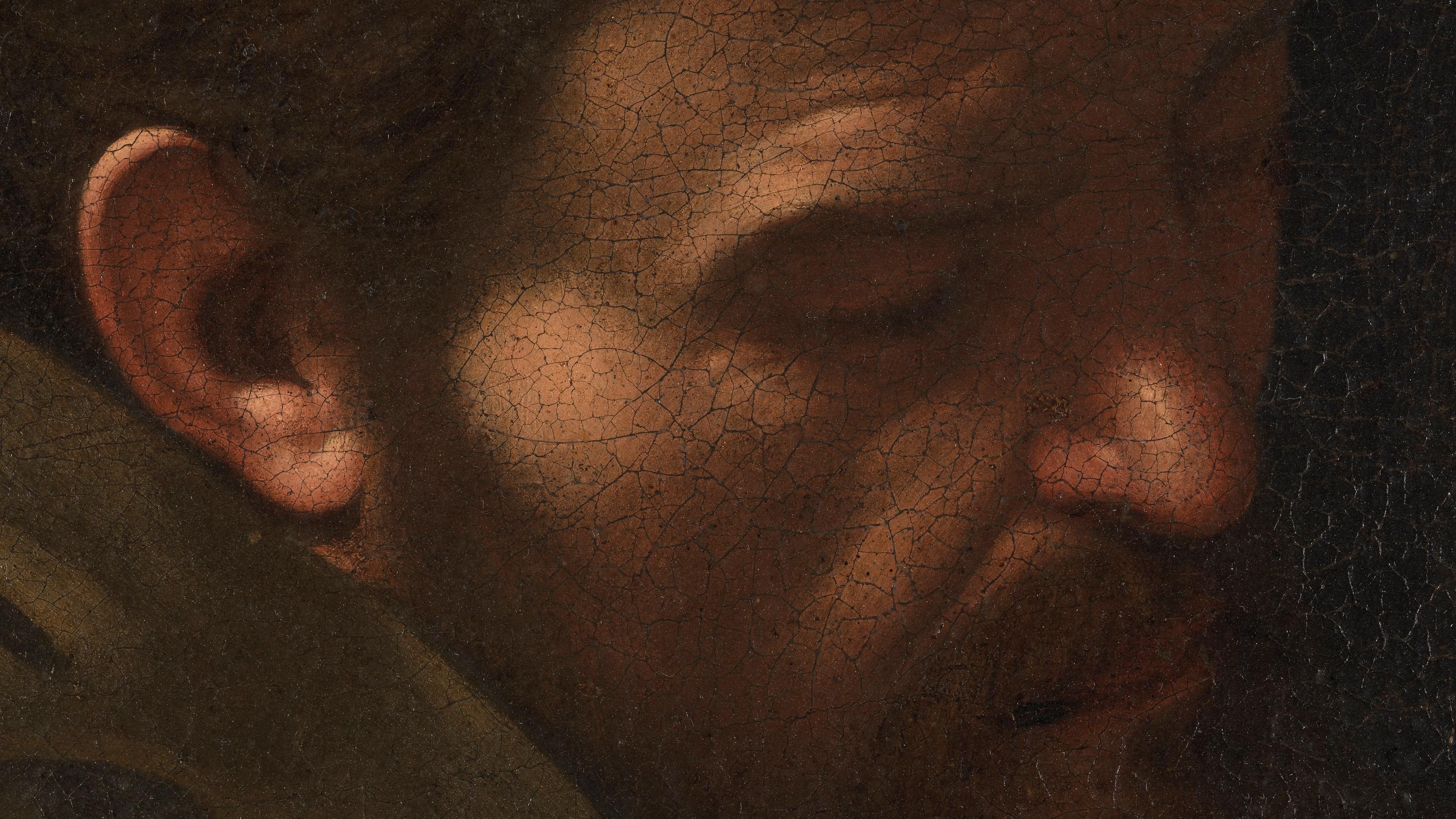 Close-up of an old painting showing a man’s face in profile with visible crackling in the paint surface.