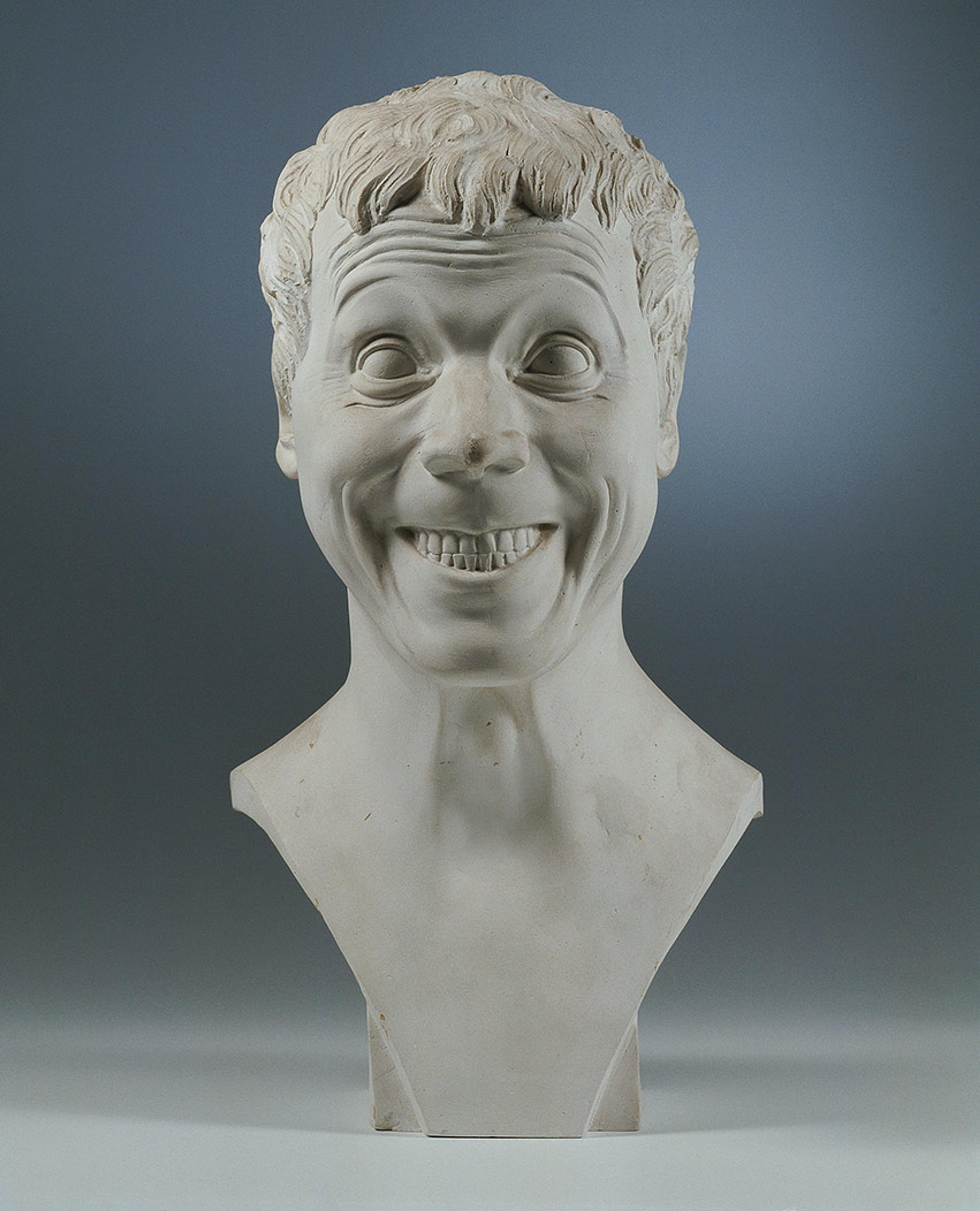 Bust with exaggerated smiling face and wide eyes.
