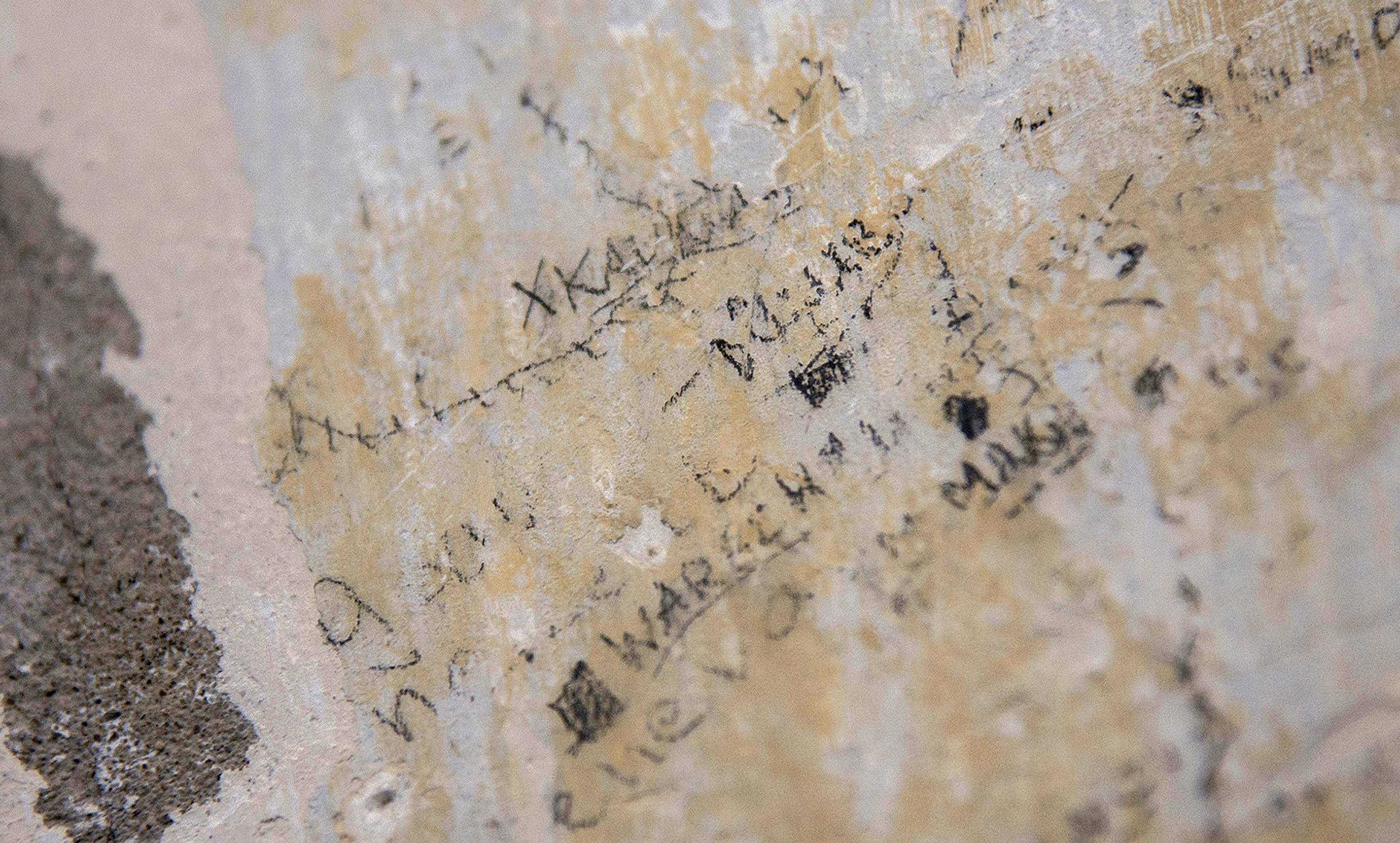 <p>Recently discovered prisoner writings on the wall of Lyon’s notorious Montluc prison from which <em>résistant</em> and historian Marc Bloch was taken and executed by the Nazis on the night of the 16 June 1944. A noted historian, Bloch wrote: ‘The task of the historian is understanding, not judging.’ <em>Photo by Bony/AP/Rex</em></p>