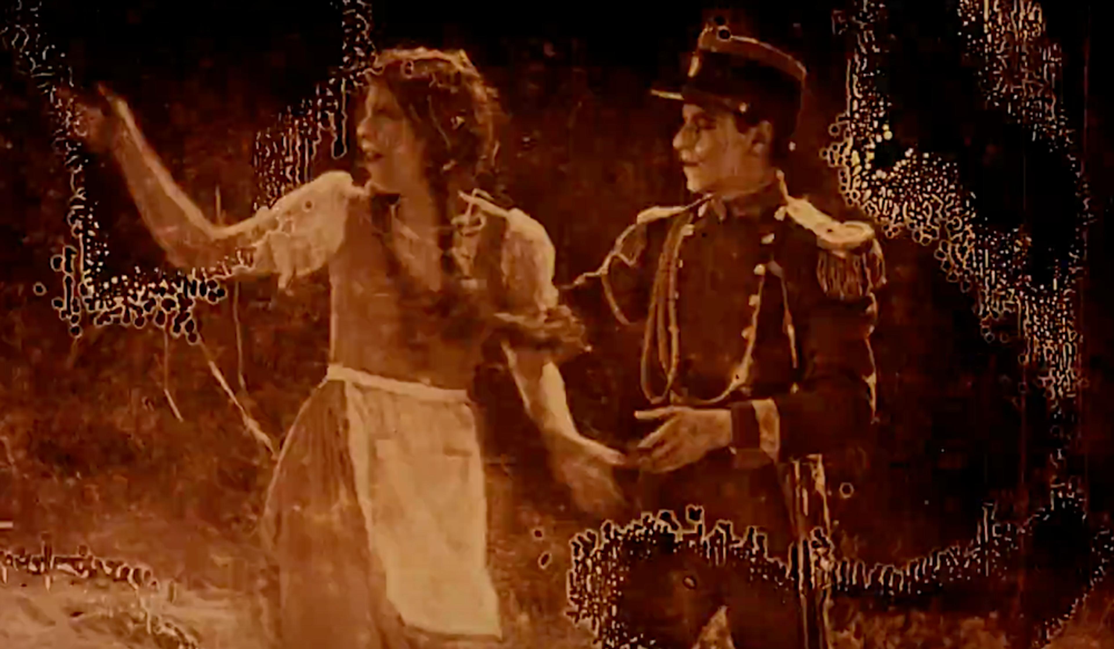 A sepia-toned photo of a woman in a dress and apron gesturing with a man in a military uniform beside her against a worn background.