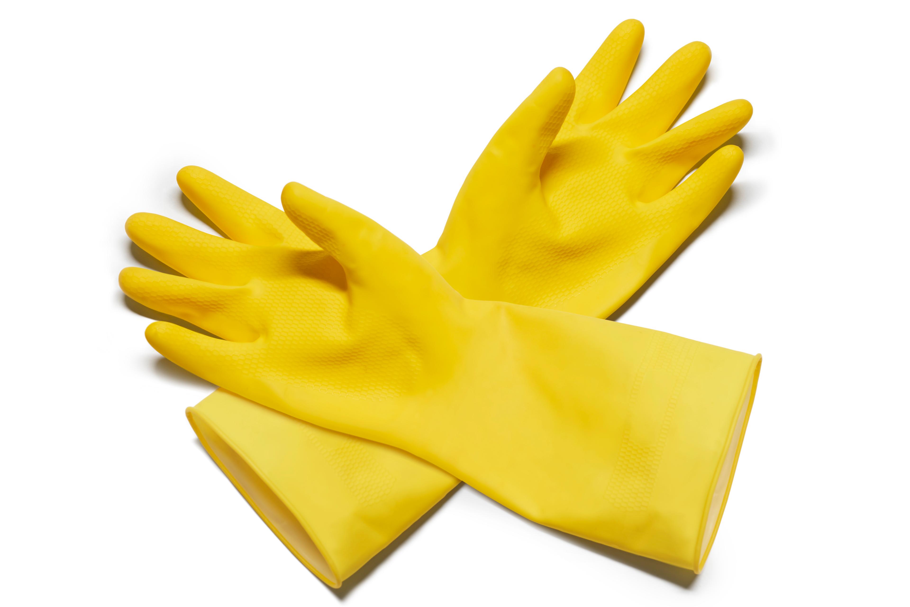 Photo of a pair of yellow rubber gloves on a white background.
