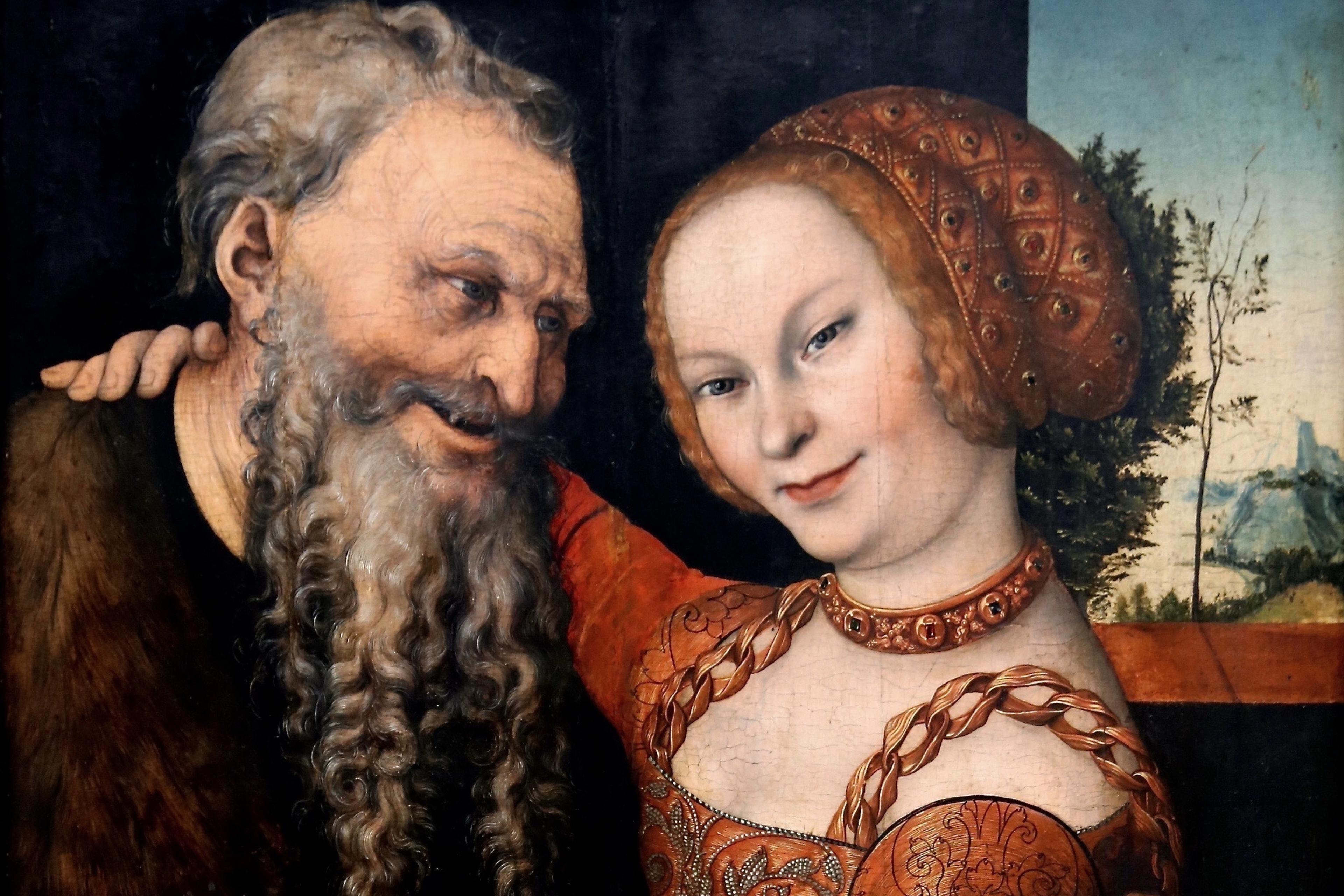 Painting of an elderly man with a beard and a young woman in a red dress, both in a warm embrace with a landscape backdrop.