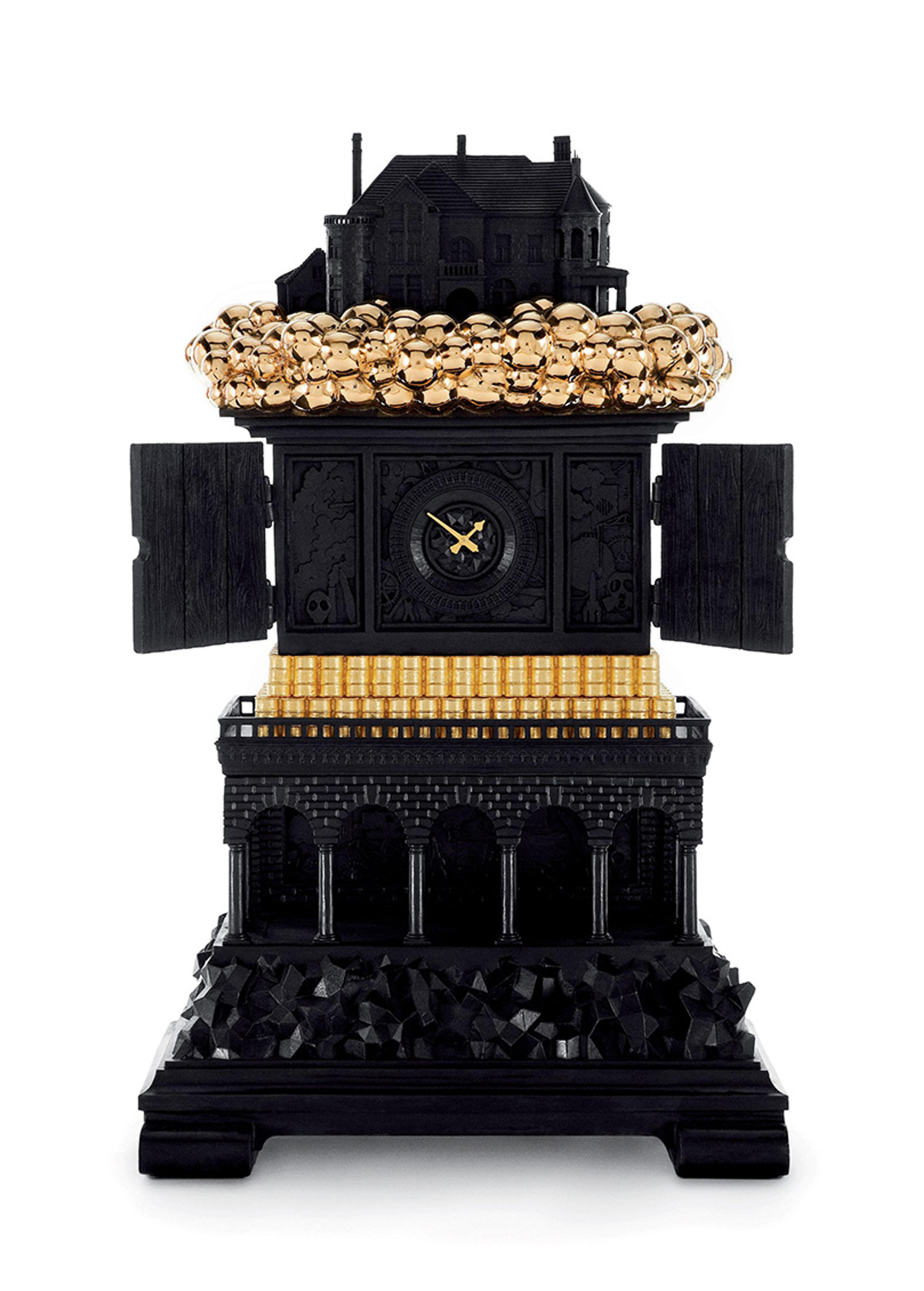 Photo of an ornate black clock with golden accents, resembling a small building with a decorated roof, a clock face, and arched columns.