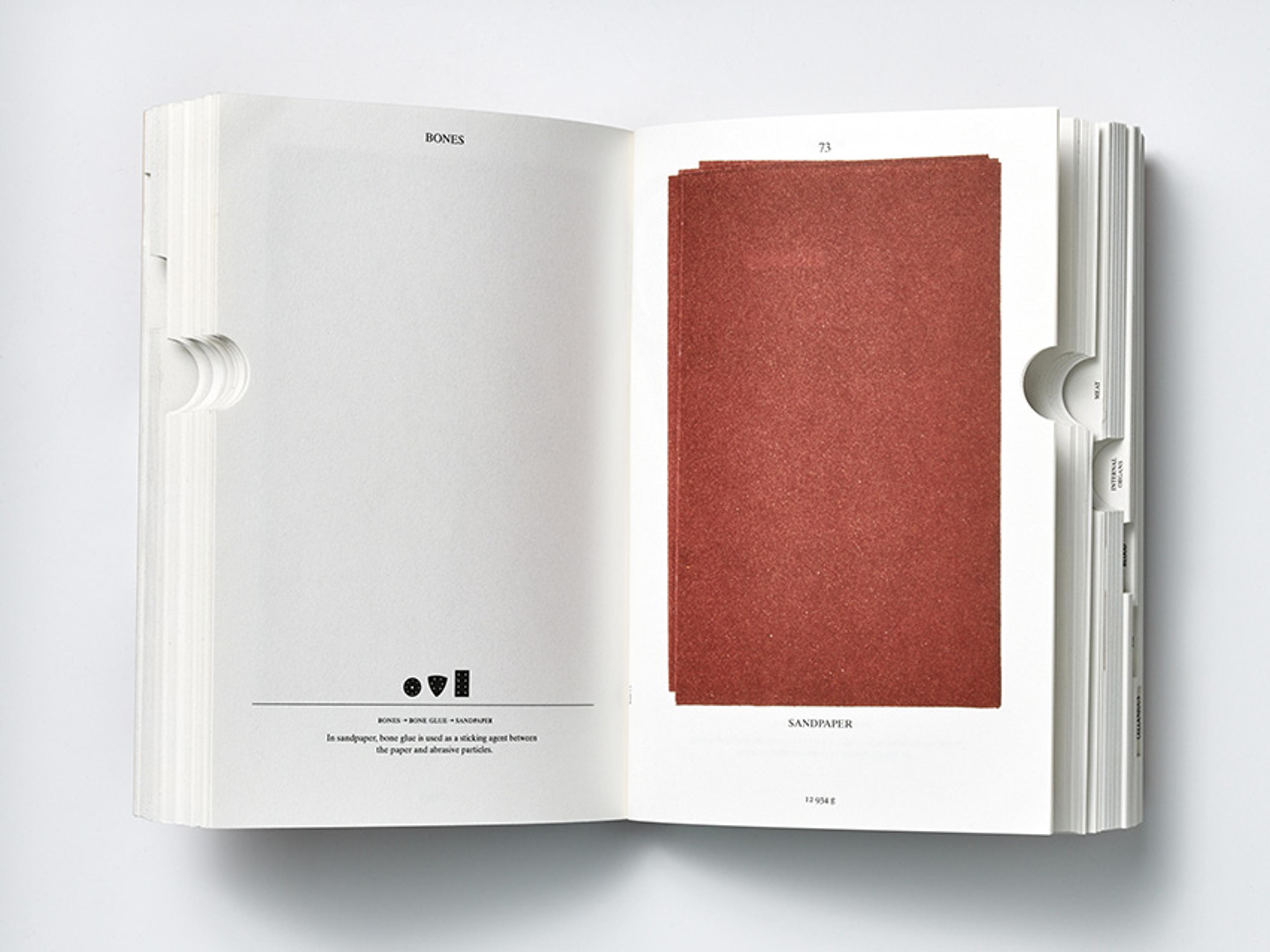 An open book displaying a red rectangular piece of sandpaper attached to the right page and text descriptions on the left page.