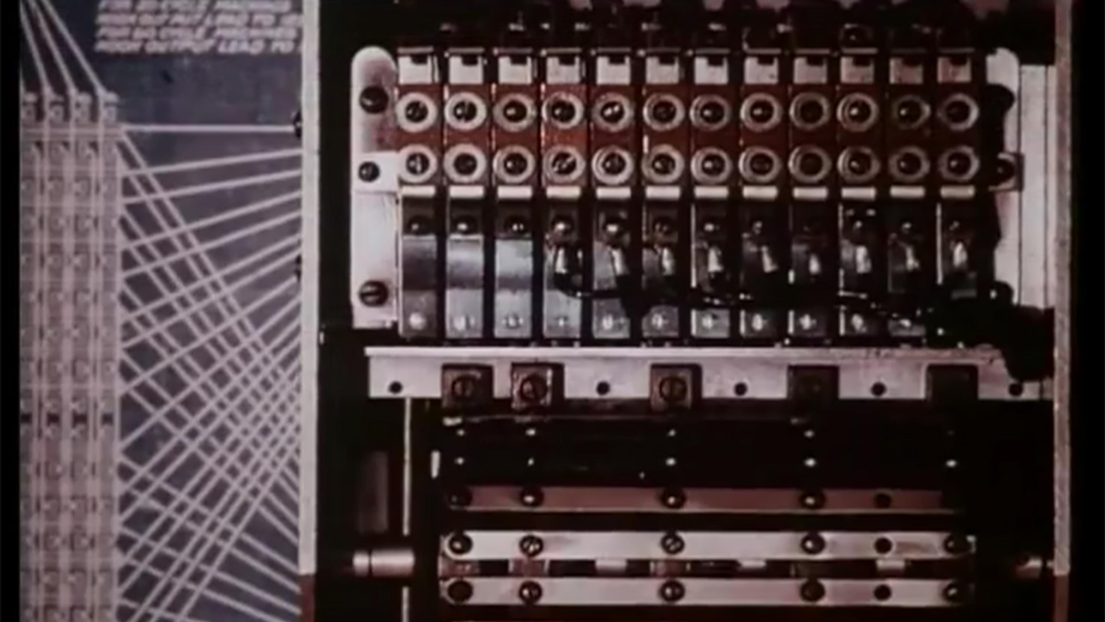A vintage mechanical machine with gears, switches and an abstract schematic on the left side.