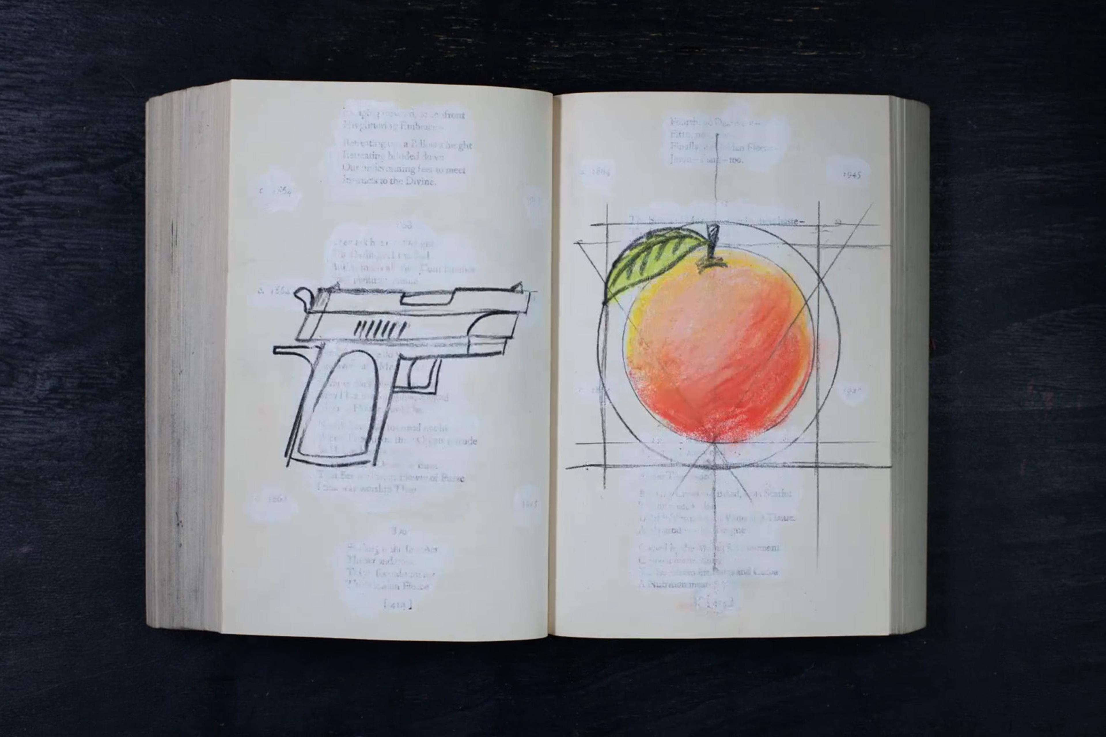 Open book with sketches of a handgun on the left page and a peach with geometric lines on the right page, on a dark surface.