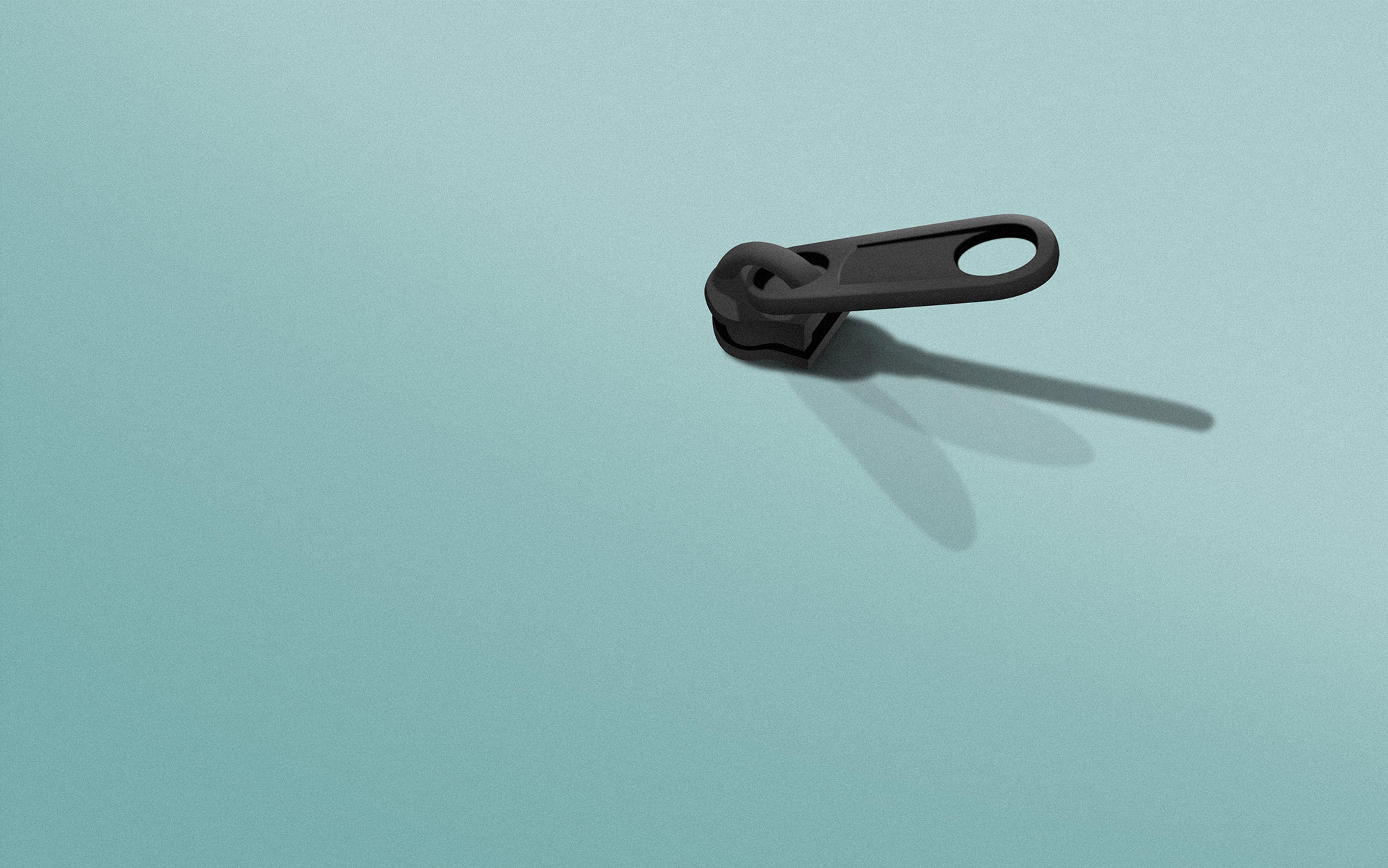 Illustration of a single black zip slider part on a pale teal background with a shadow cast to the right.