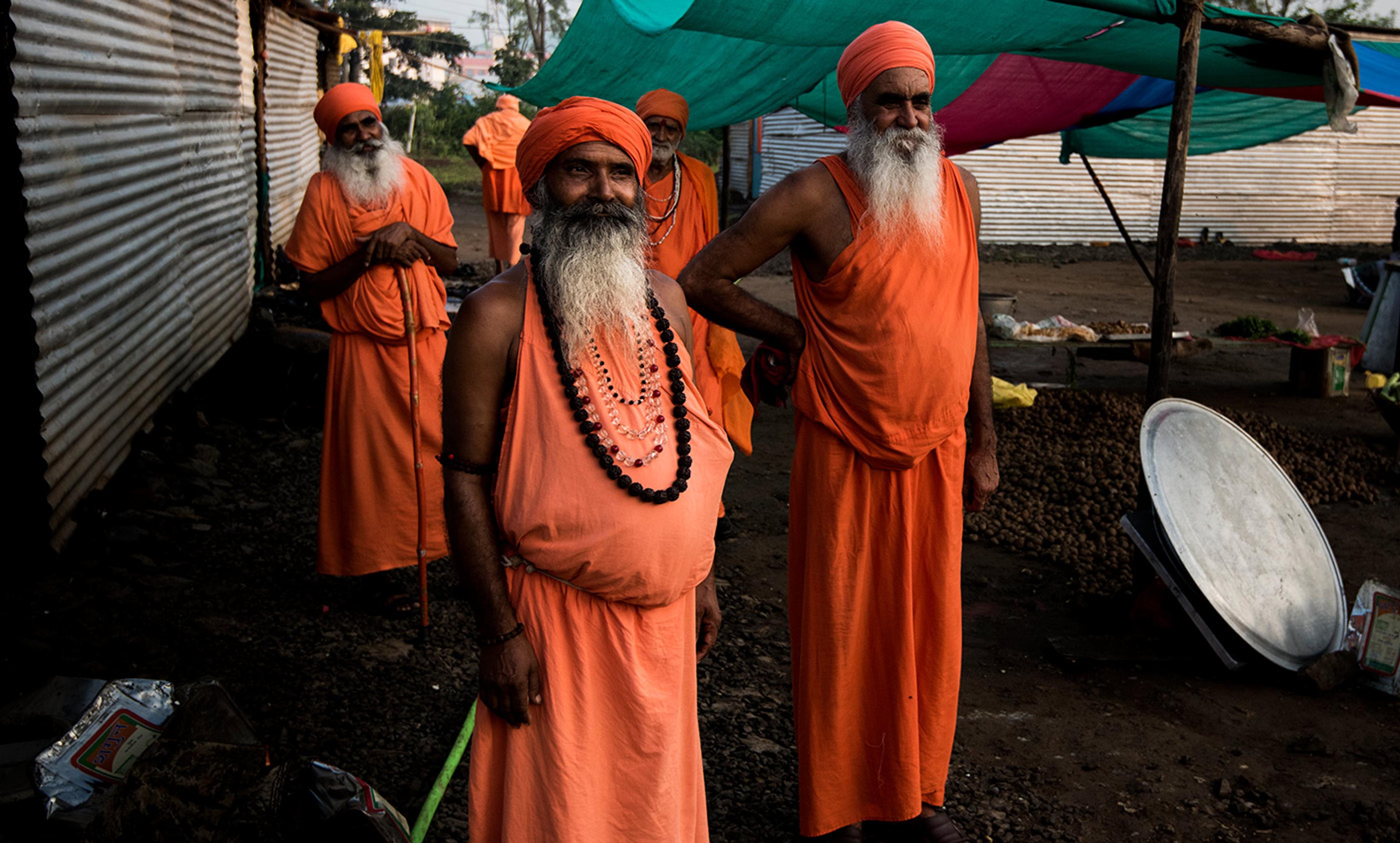 <p>Holy Men attending the Hindu festival of Kumbh Mela in Nashik, India. <em>Photo by David Baxendale/Flickr</em></p>