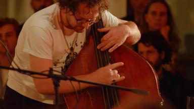 Close up of Samuel Pankhurst playing the double bass