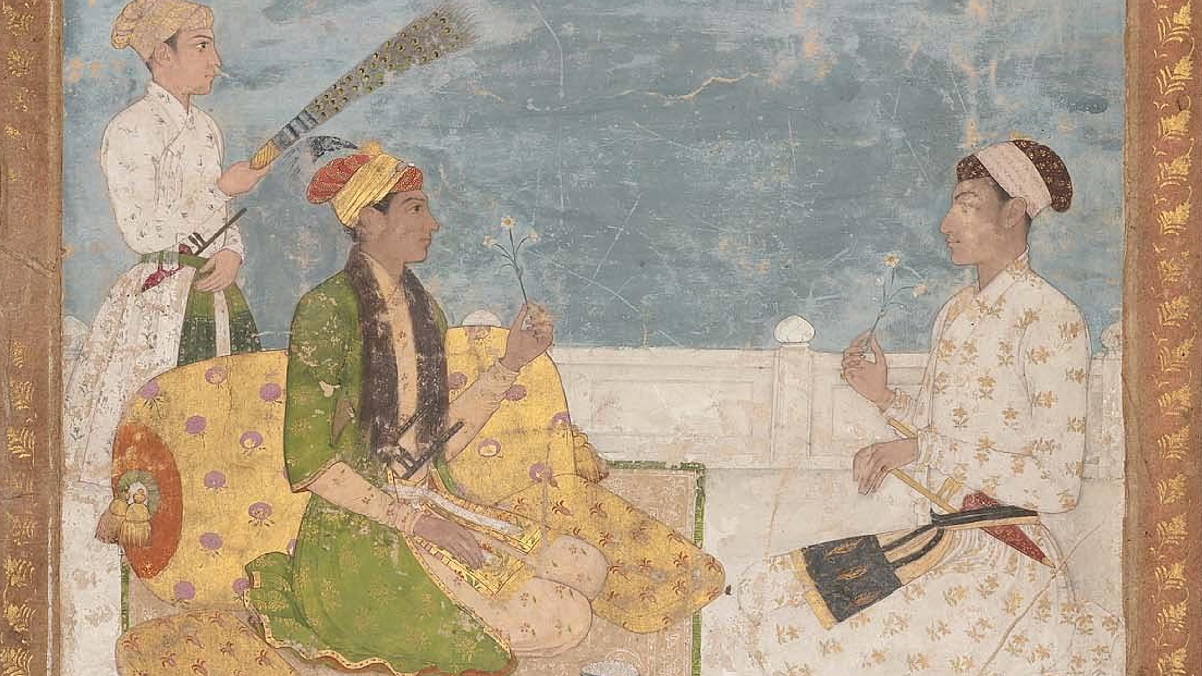 Indian miniature painting of three figures with flowers and a fan on a terrace, bordered with gold leaf.