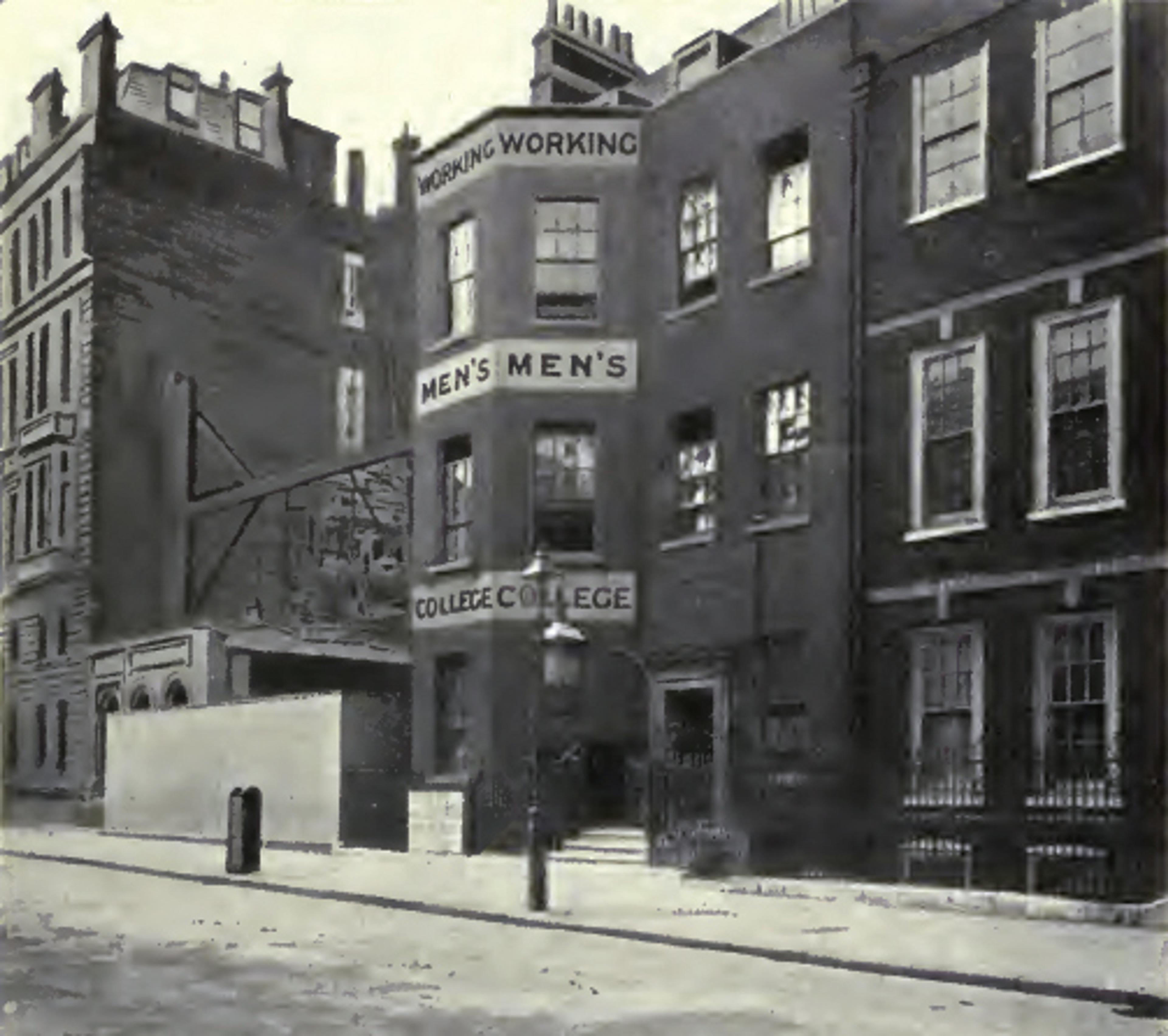 Vintage photo of a city street with old buildings, one labelled ‘Working Men’s College’ and a lamppost in front.