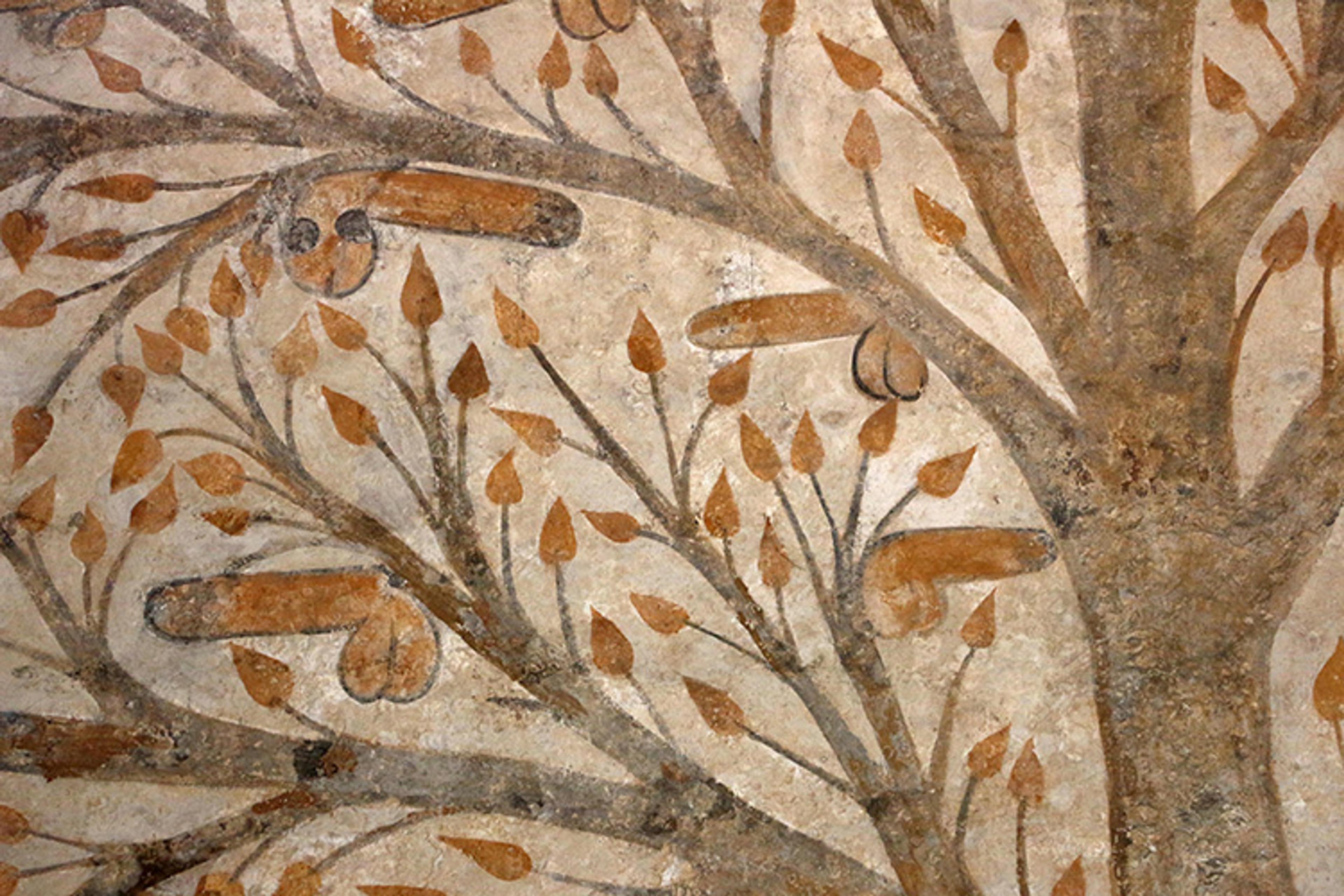A mediaeval fresco painting of a tree with leaves and phallic shapes on its branches, using earth tones and rustic style.