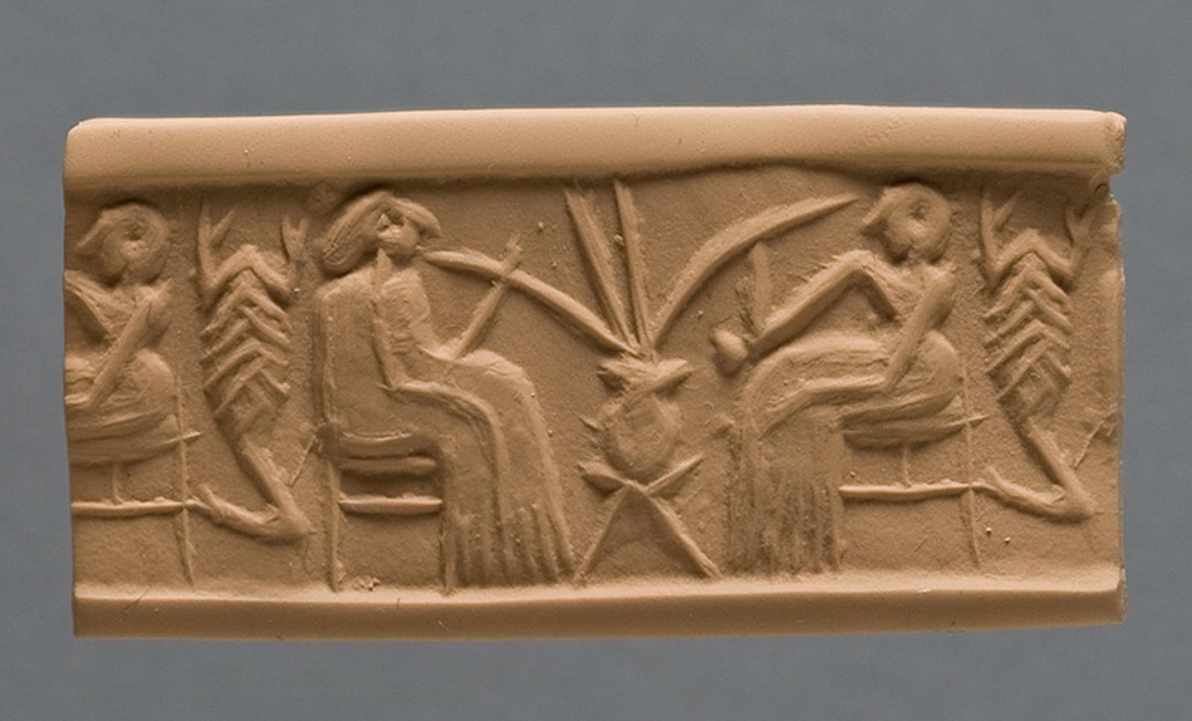 Ancient clay cylinder seal with seated figures and plants, featuring intricate carvings and a neutral background.